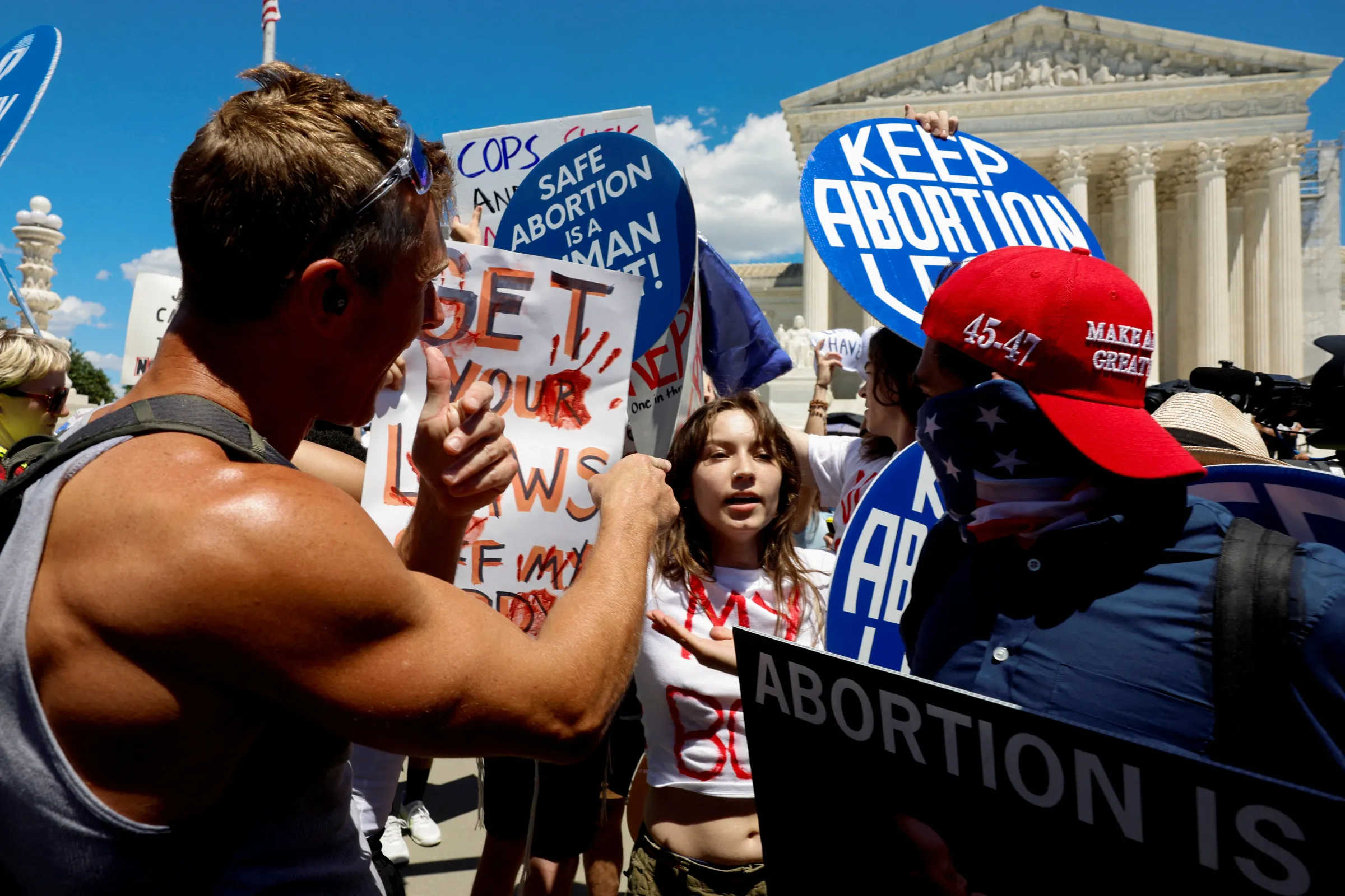 A counter protester point his figner to an abortion rights activist as activists gather at the U.S. Supreme Court to mark the second anniversary of the Court overturning Roe v. Wade, in Washington, U.S., June 24, 2024. , U.S., June 24, 2024. REUTERS/Evelyn Hockstein