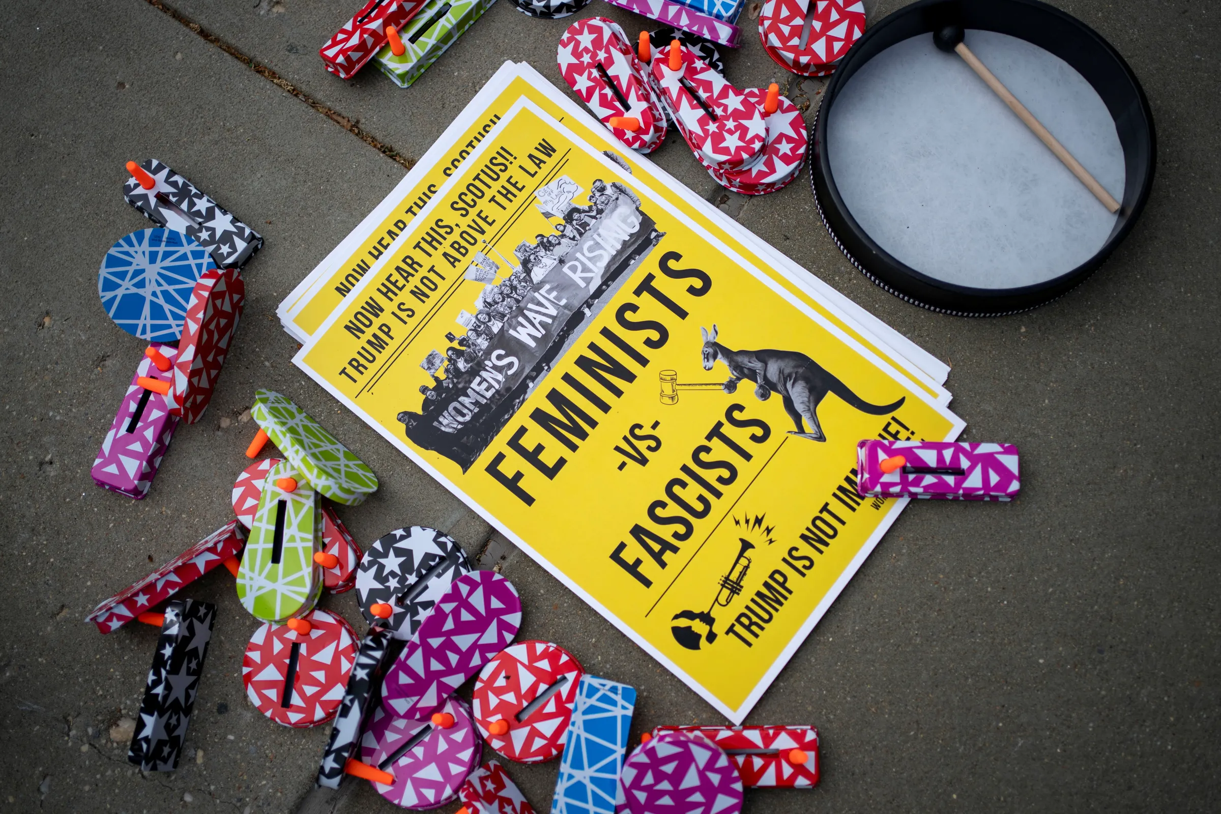 Women’s March activists set out noise makers and posters ahead of a demonstration outside the U.S. Supreme Court in Washington, U.S., April 25, 2024. REUTERS/Bonnie Cash