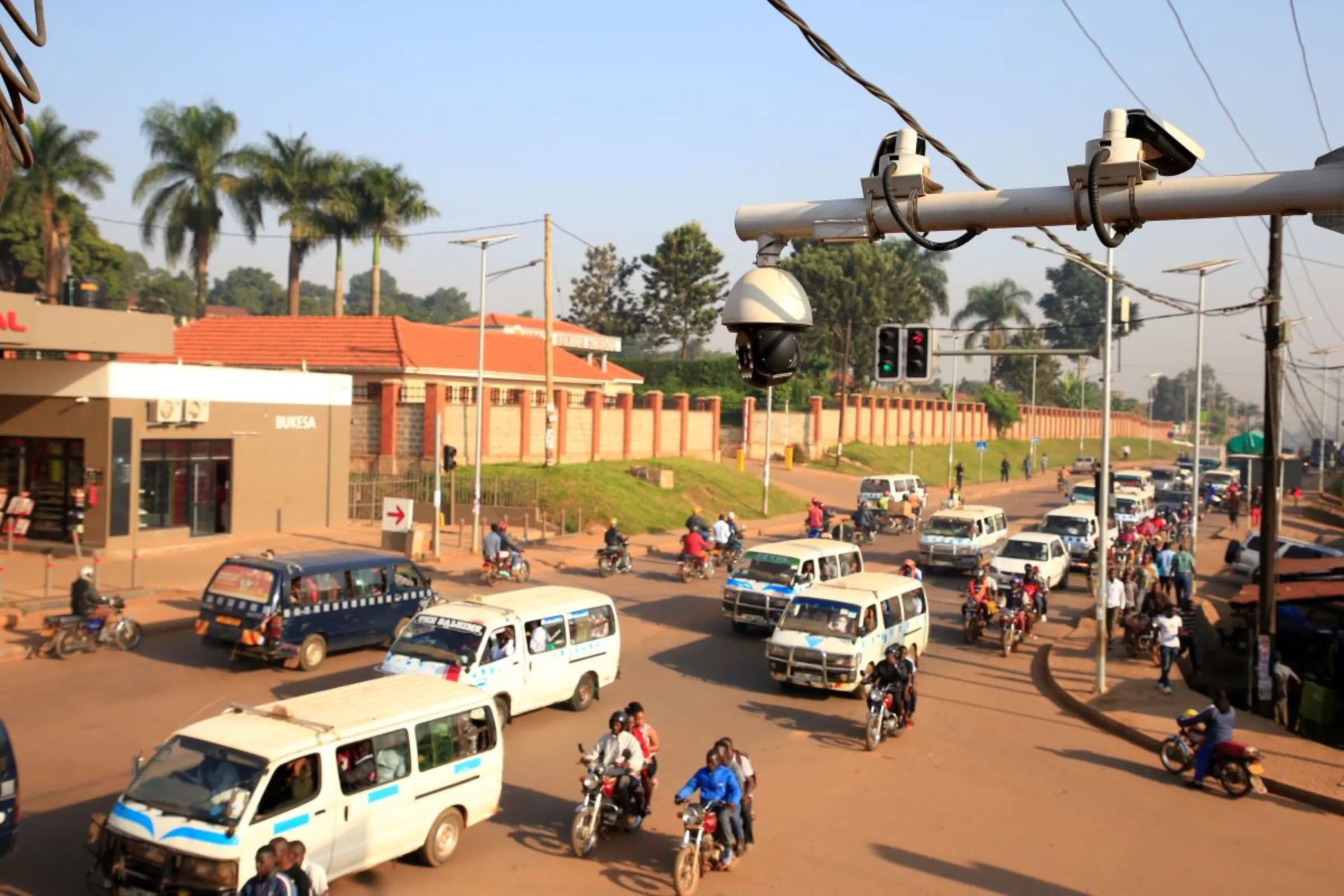 Traffic flows under the surveillance closed-circuit television camera (CCTV) system along Bakuli street in Kampala, Uganda August 14, 2019