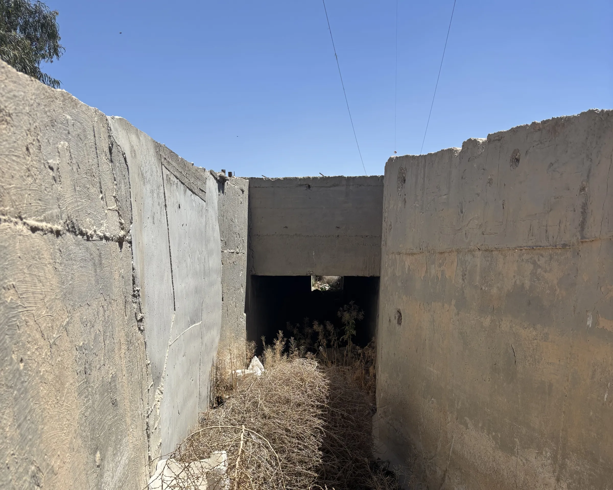 The insides of dry irrigation canal. Al- Nashabiyah, Syria, May 19, 2025. Thomson Reuters Foundation/Nazih Osseiran.