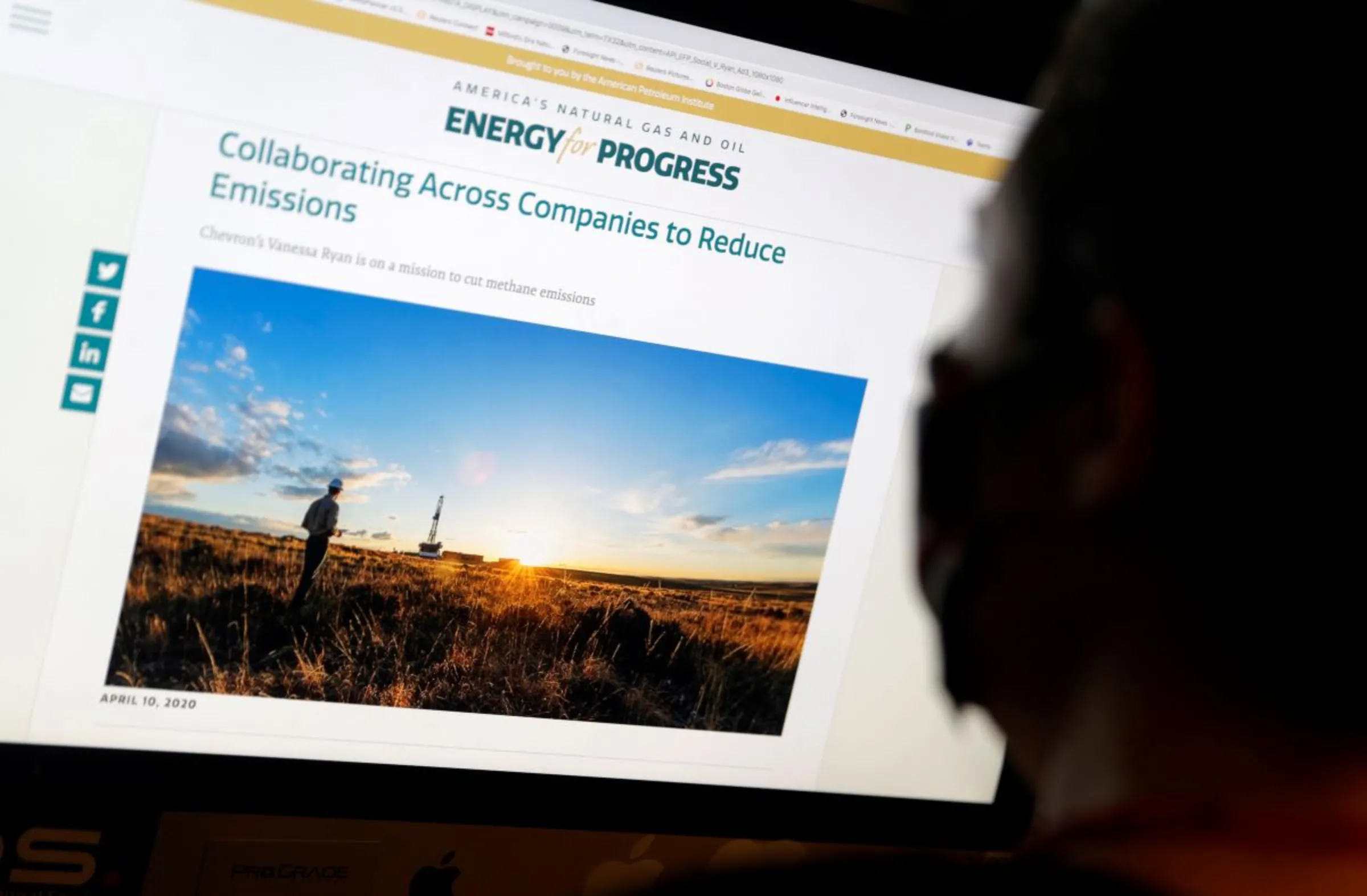 A person views an online advertisement that ran on Facebook and was paid for by the American Petroleum Institute as part of their Energy For Progress campaign to cast natural gas as climate-friendly, in this illustration picture taken August 6, 2020. Picture taken August 6, 2020. REUTERS/Mike Segar/Illustration