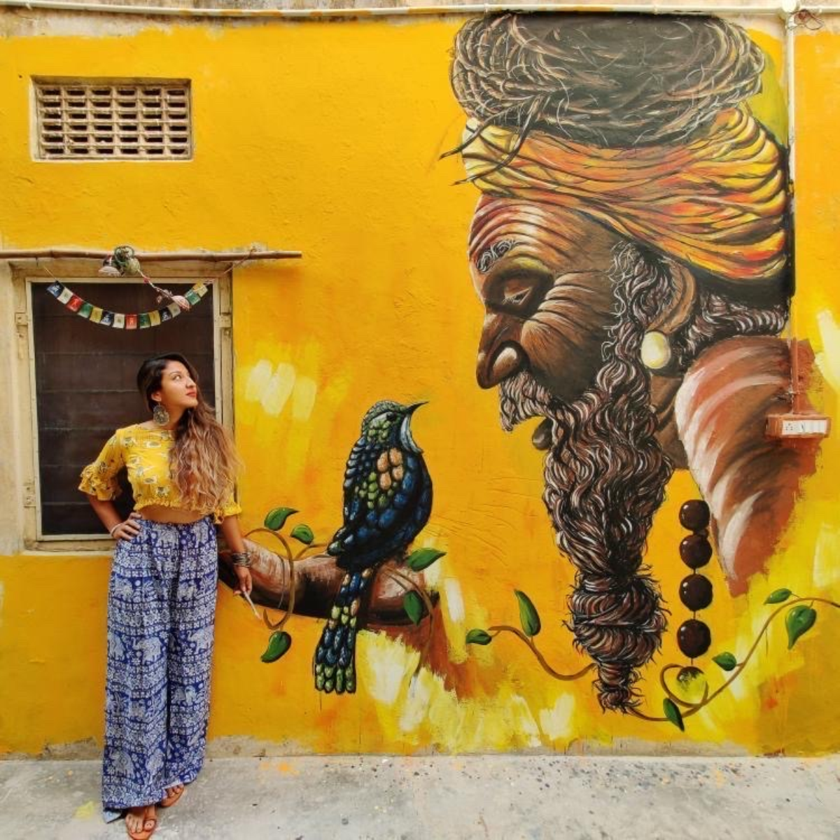 Sneha Chakraborty posing with her artwork. Artists like Sneha are fast gaining a following in the crypto space./Photos courtesy of Sneha Chakraborty