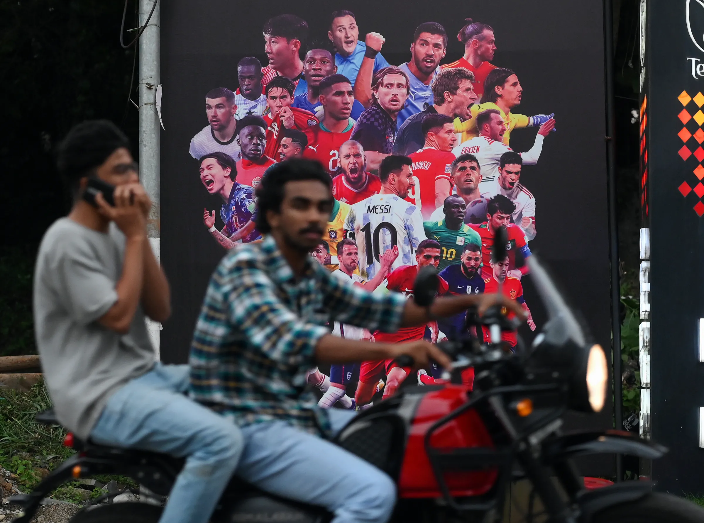 Poster for the upcoming FIFA World Cup on a highway in Perinthalmanna in southern Kerala state, India, August 29, 2022. Thomson Reuters Foundation/Gokul