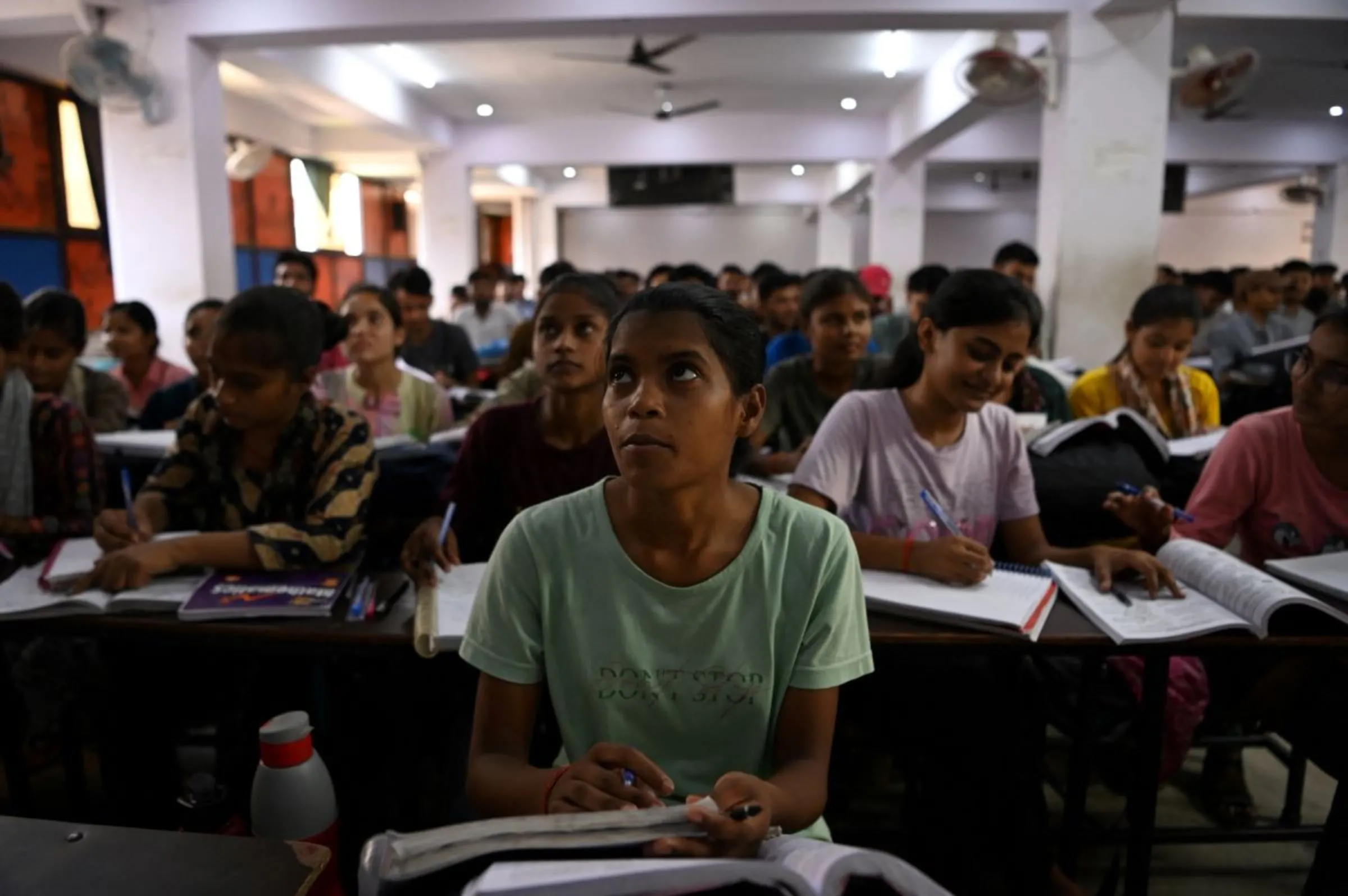 Students attend a class at Super Climax Academy, a coaching institute training students to prepare for competitive examinations to secure government jobs, in Prayagraj, India, June 21, 2024. REUTERS/Sahiba Chawdhary