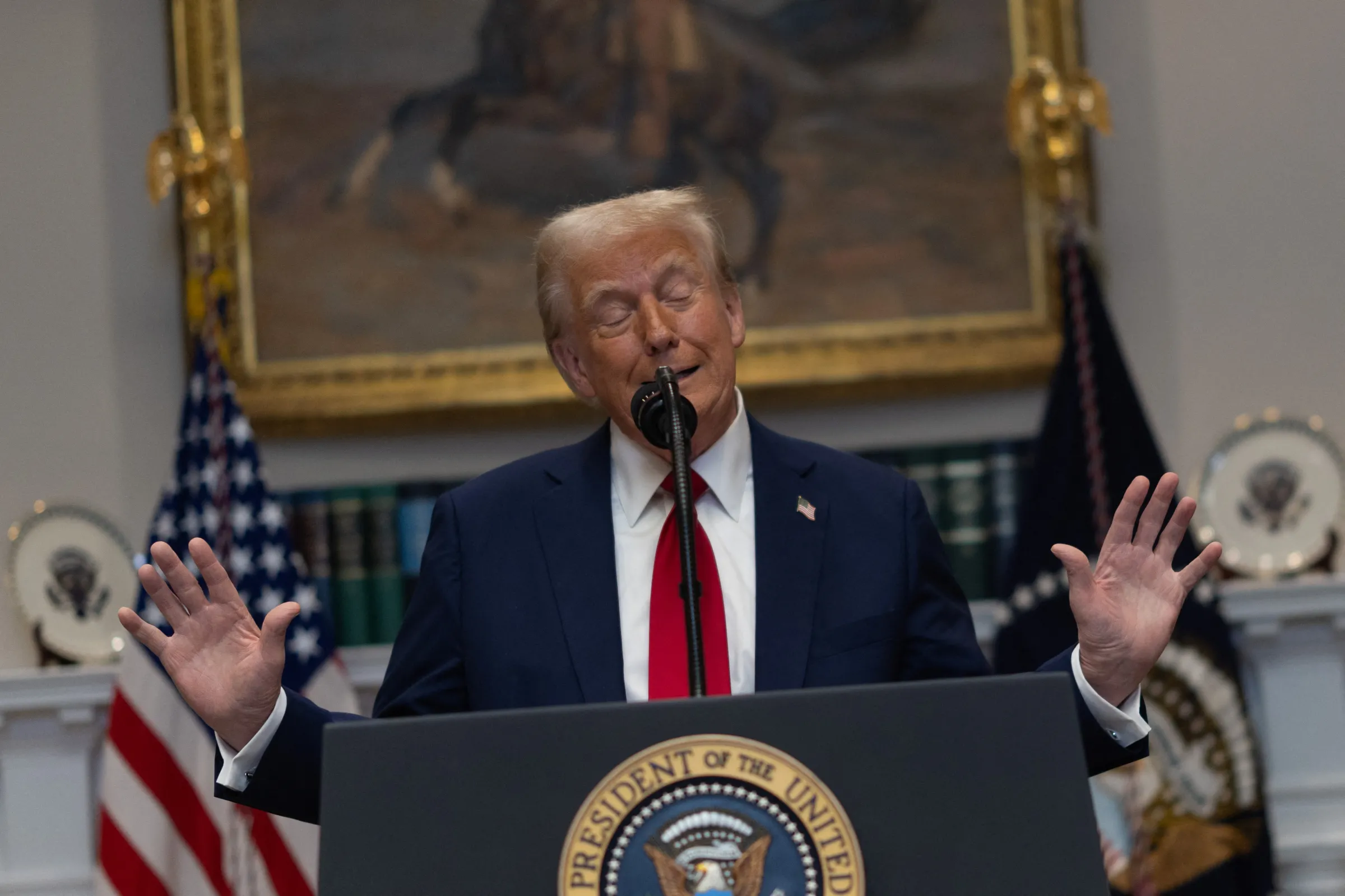 U.S. President Donald Trump reacts as he delivers remarks on AI infrastructure at the Roosevelt room at White House in Washington, U.S., January 21, 2025. REUTERS/Carlos Barria