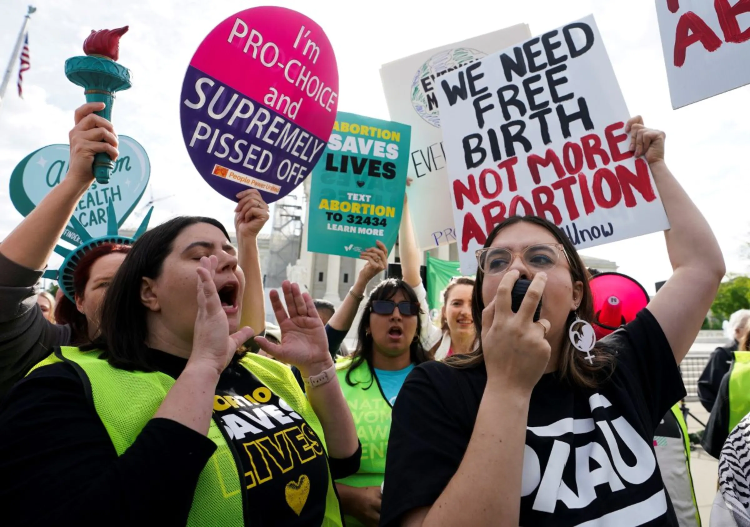 Abortion rights supporter and anti-abortion activists square off on the day the Supreme Court justices hear oral arguments over the legality of Idaho's Republican-backed, near-total abortion ban in medical-emergency situations, at the U.S. Supreme Court in Washington, U.S., April 24, 2024. REUTERS/Kevin Lamarque