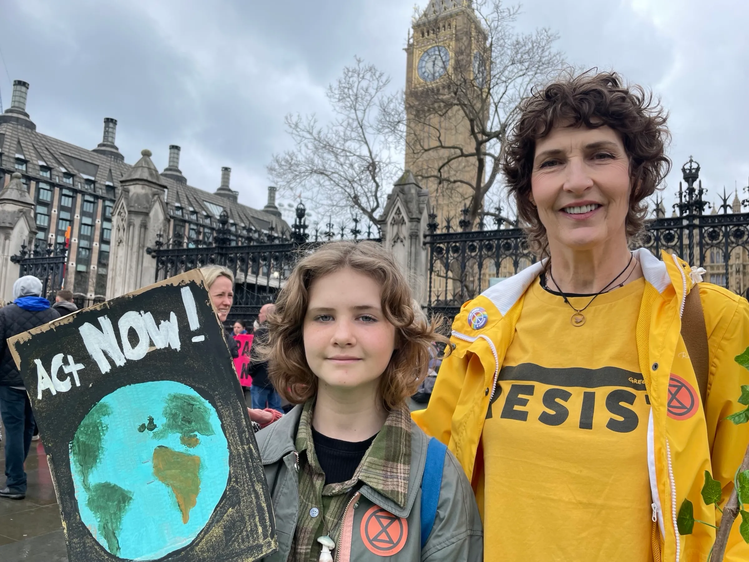 Pearl Konopka and Vanessa Lockett join “The Big One”, a protest organised by Extinction Rebellion outside Parliament in London on April 21, 2023. Thomson Reuters Foundation/Laurie Goering