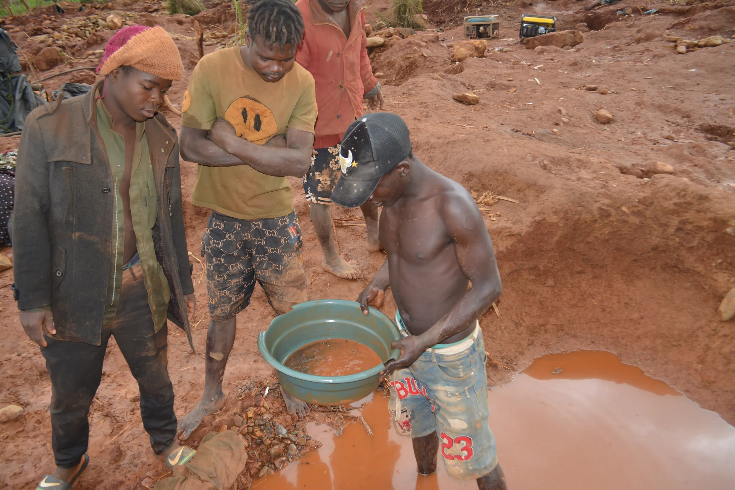 Miners panning for gold by washing ore in Mucurumadze, Manica Province, Mozambique, 23 July, 2025. Thomson Reuters Foundation/Samuel Come