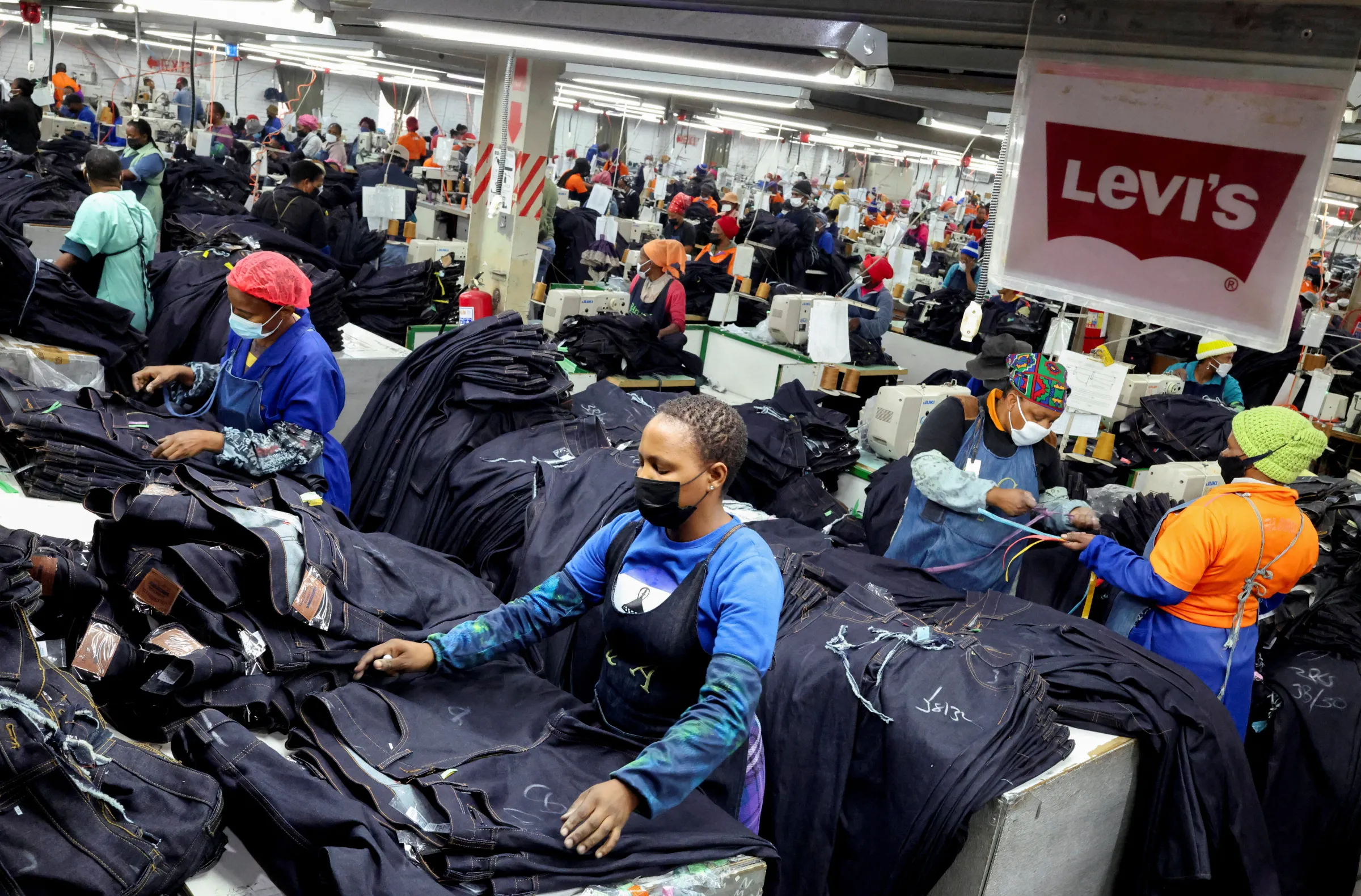 Workers perfom their duties at the Nien Hsing Textile factory, on the outskirts of Maseru, the capital of Lesotho, April 4, 2025. REUTERS/Siphiwe Sibeko