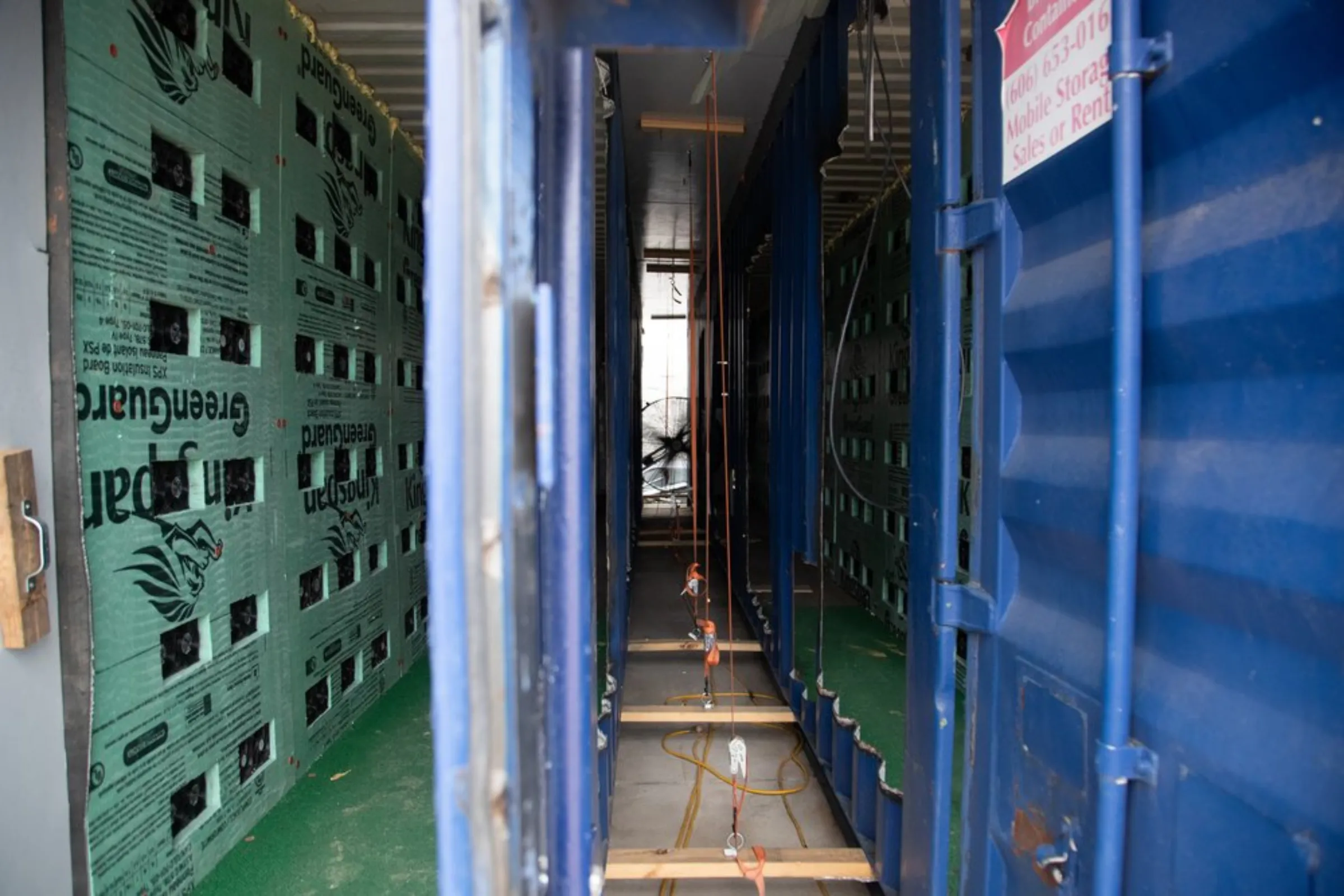 Mining rigs inside a container at the bitcoin mining site in Inez, Kentucky, January 25, 2022. Thomson Reuters Foundation/Amira Karaoud