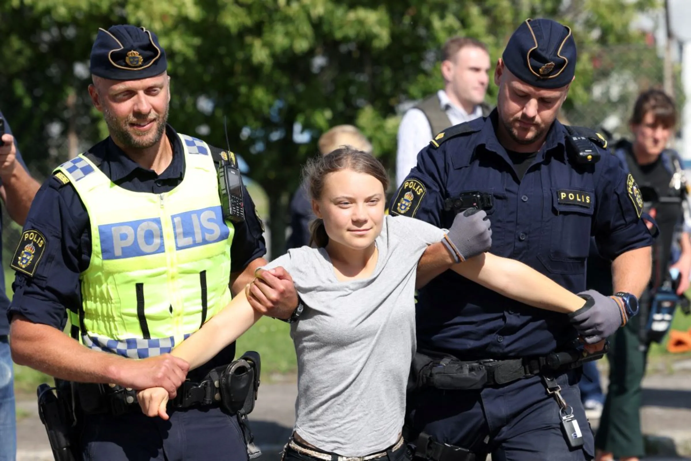 Swedish climate activist Greta Thunberg is lifted away by police when she takes part in a new climate action in Oljehamnen in Malmo, Sweden July 24, 2023