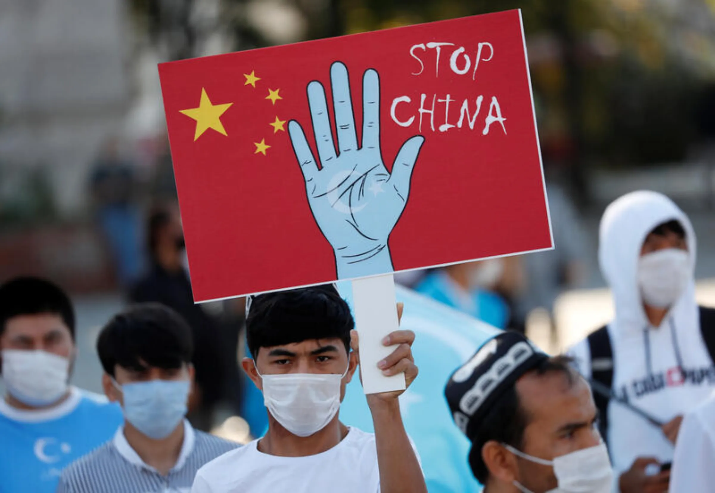 A CCTV security surveillance camera overlooks a street as people walk following the spread of the coronavirus disease (COVID-19) in Beijing, China May 11, 2020. Picture taken May 11, 2020. REUTERS/Thomas Peter