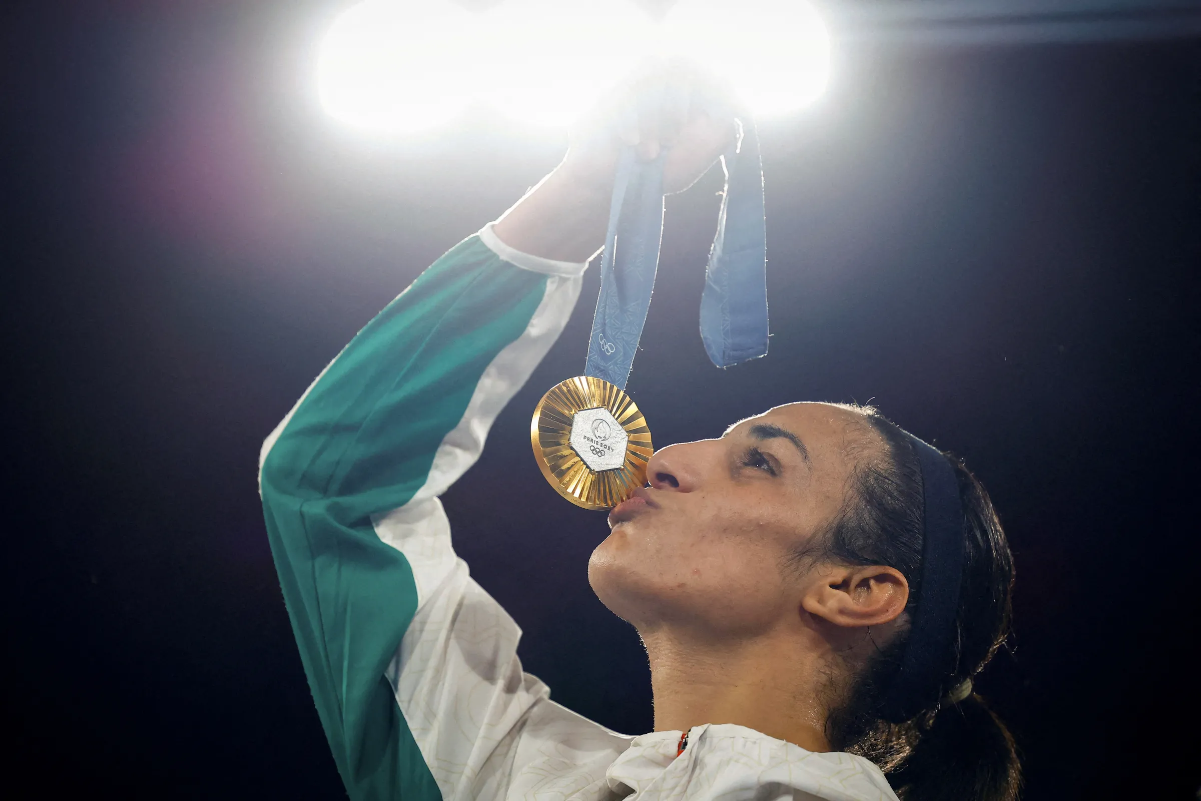 Gold medallist Imane Khelif of Algeria kisses her medal, in Paris, France,  August 09, 2024. REUTERS/Peter Cziborra