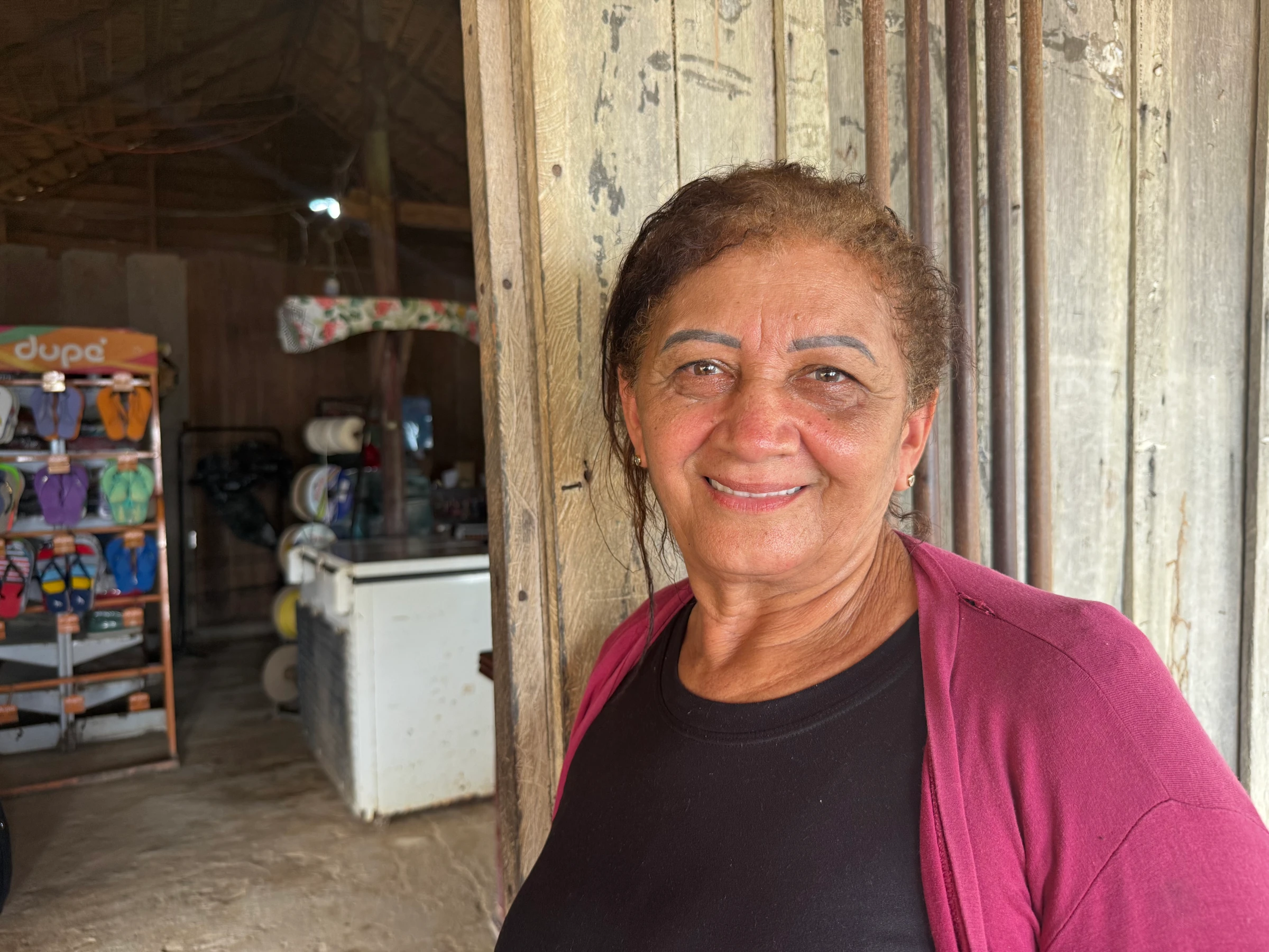 Ana Rita Da Cunha, 56, outside her shop in Mamae Anan, Brazil, Jan 8. 2025. Thomson Reuters Foundation/Dan Collyns