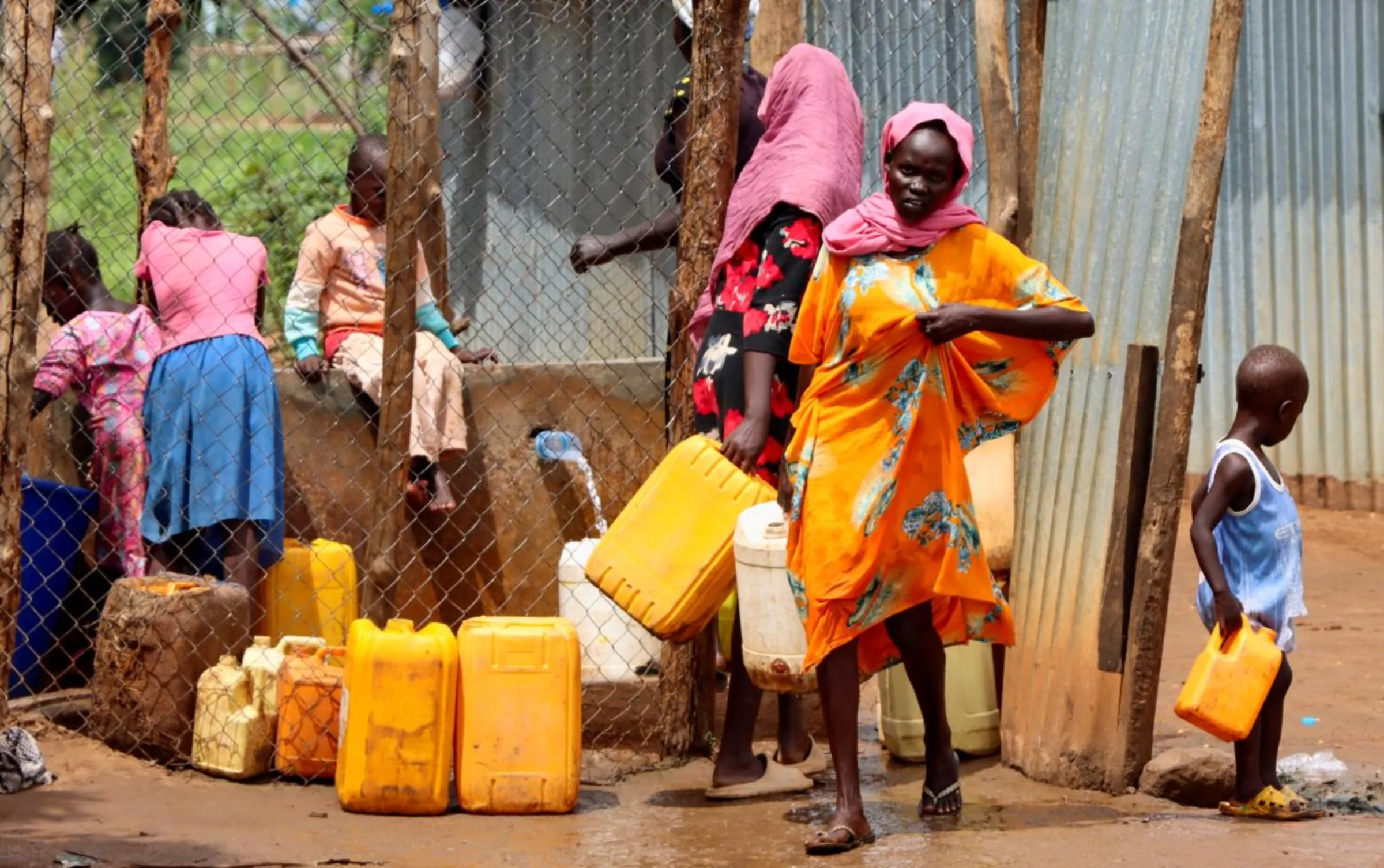 Sudanese refugees collect water from a tap at the Gorom Refugee camp hosting Sudanese refugees on World Refugee Day, to celebrate the strength and courage of people who have been forced to flee their home country to escape conflict under the theme 'hope away from home' near Juba, in South Sudan June 20, 2023