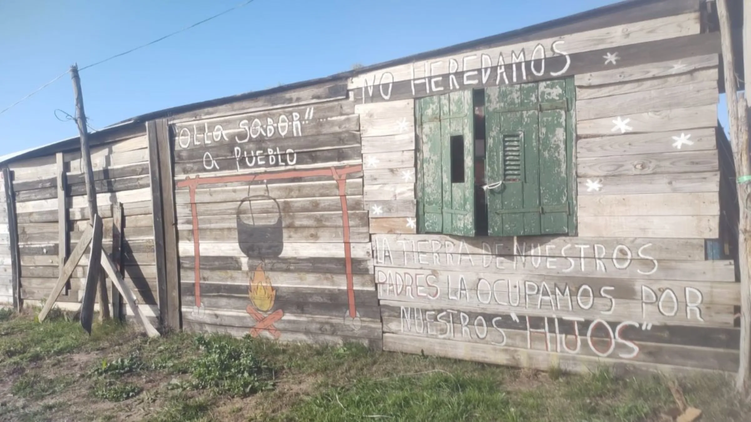 In Nuevo Comienzo, a disadvantaged neighborhood on the outskirts of Montevideo, a message adorns the walls: 'We do not inherit our land from our fathers. We occupy it for our children.' Thomson Reuters Foundation/ Fabiana Molina.