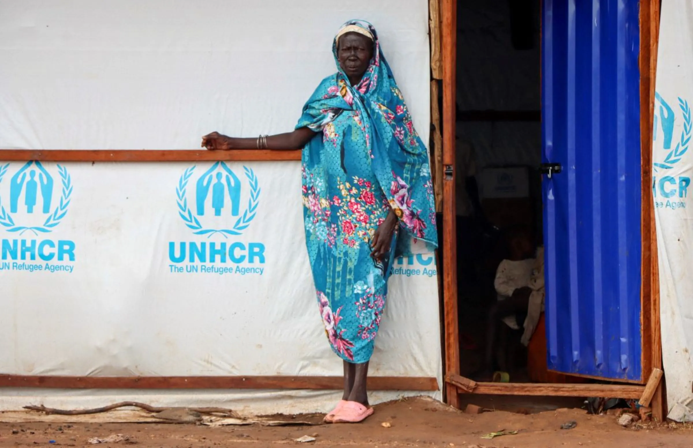 A Sudanese refugee woman stands outside a shelter at the Gorom Refugee camp hosting Sudanese refugees on World Refugee Day, near Juba, in South Sudan June 20, 2023. REUTERS/Samir Bol
