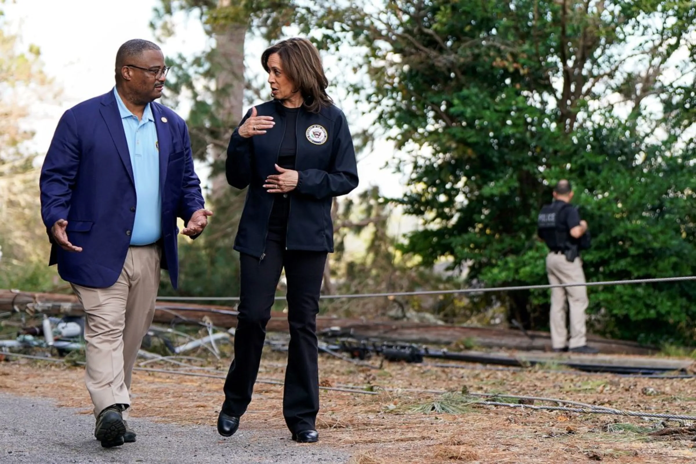 Democratic presidential nominee and U.S. Vice President Kamala Harris speaks with Mayor of Augusta Garnett Johnson, during a visit to storm-damaged areas in the wake of Hurricane Helene, in Augusta, Georgia, U.S., October 2, 2024.