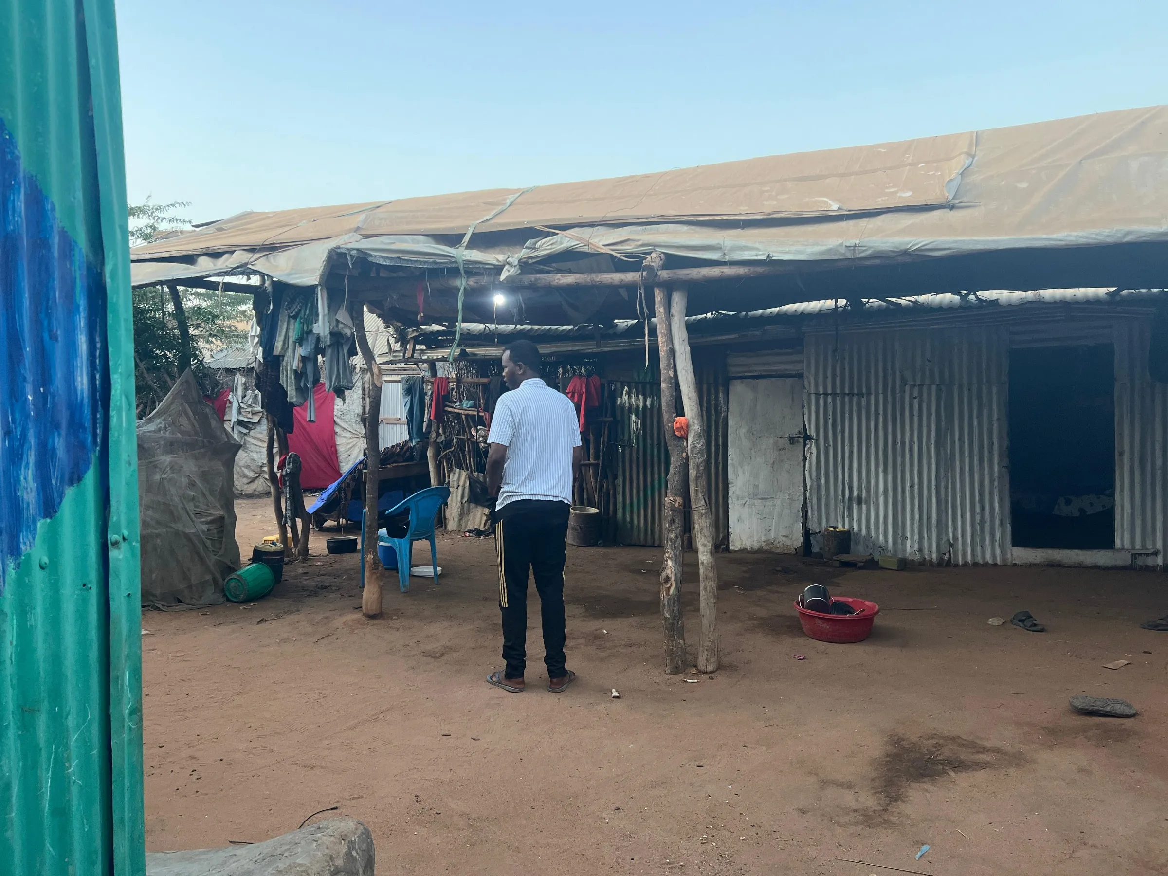 A Somali refugee who was scheduled to be resettled in the United States in January stands outside his home in Dadaab Refugee camp in Kenya's Garissa county. Thomson Reuters Foundation/Abdirizak Mohamed Sheikh