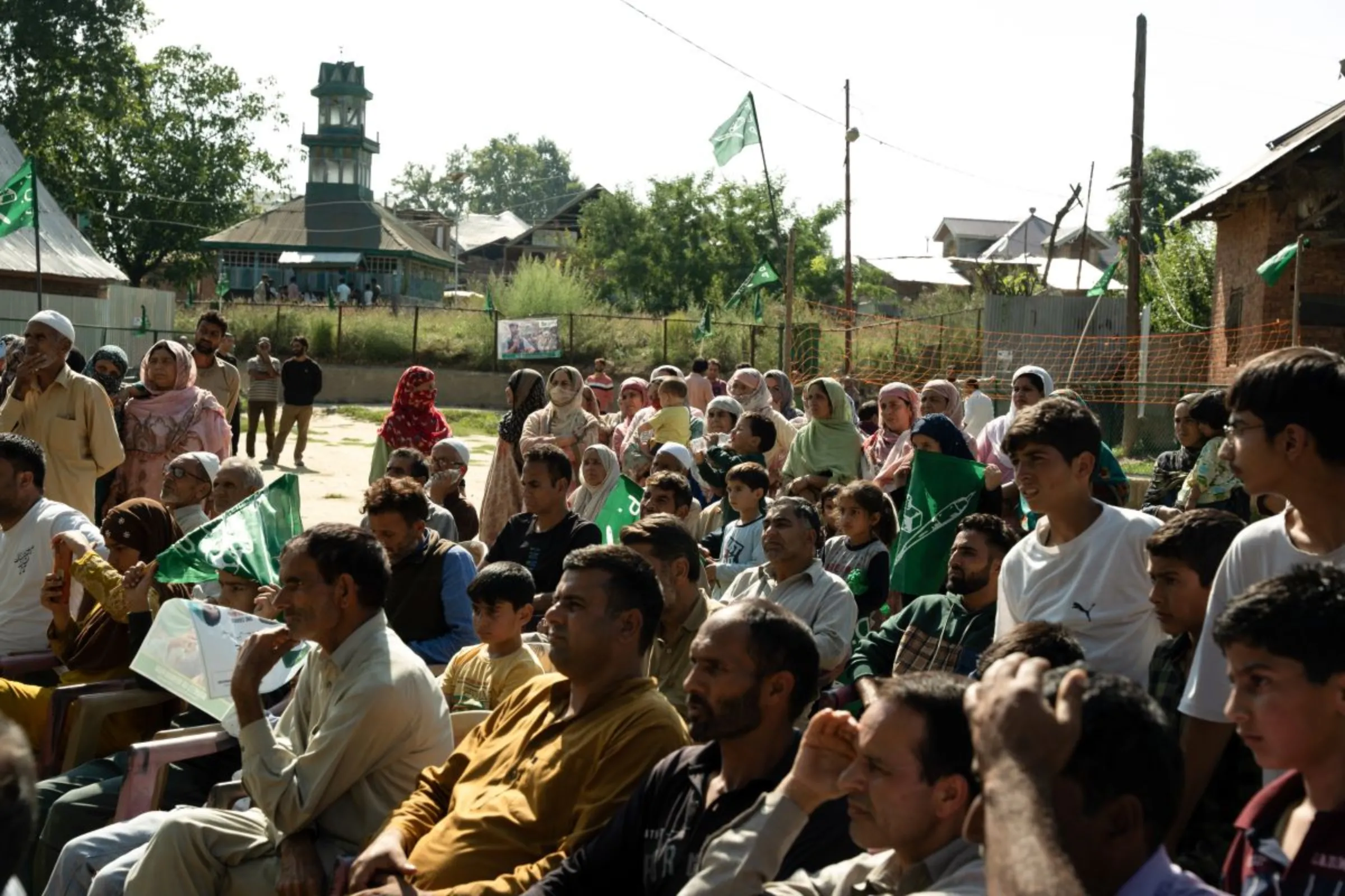 People gather for an election rally in Pulwama district, South Kashmir. August 31, 2024. Thomson Reuters Foundation/Mehran Firdous.