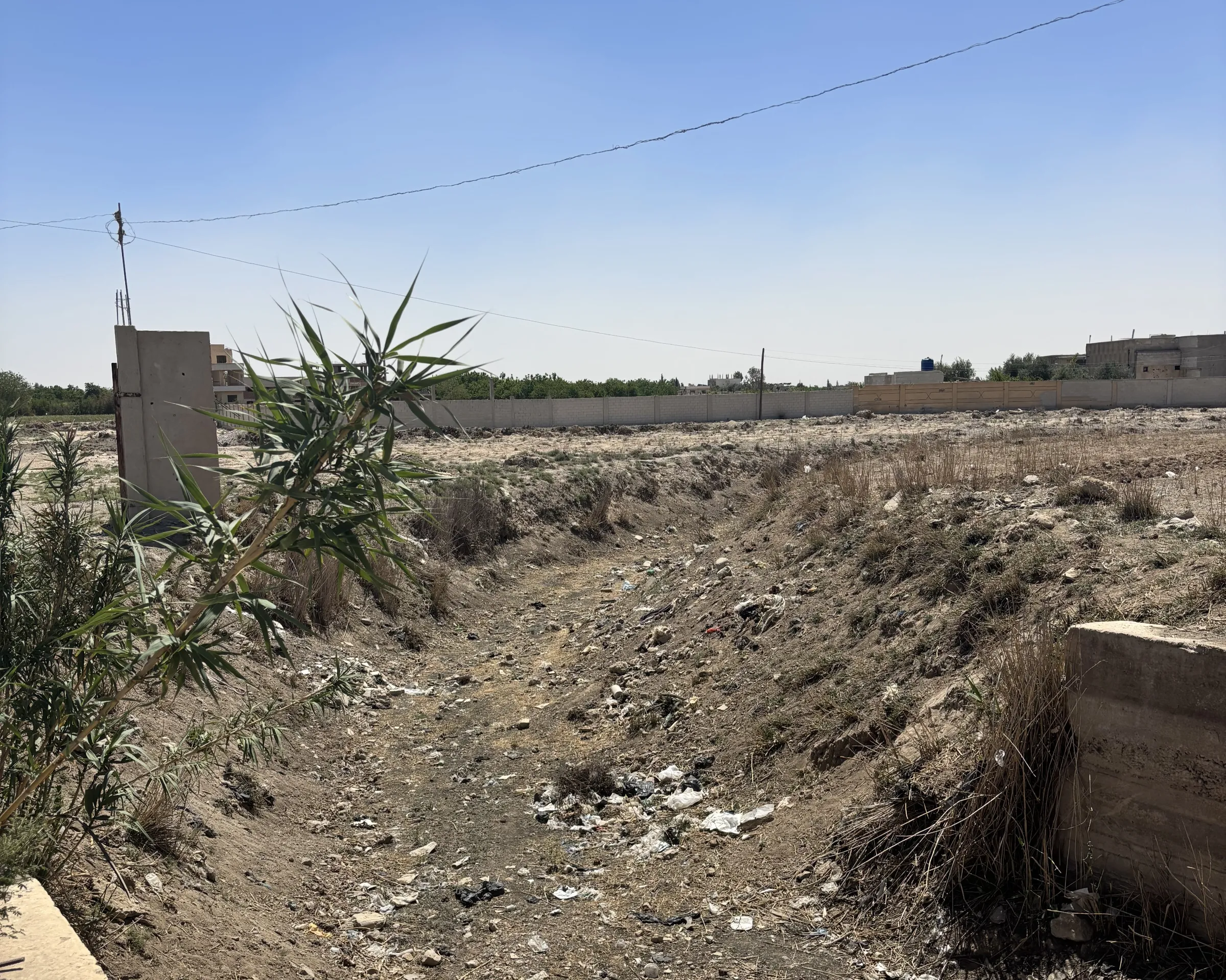A dry irrigation canal in al-Nashabiyah. Al- Nashabiyah, Syria, May 19, 2025. Thomson Reuters Foundation/Nazih Osseiran.