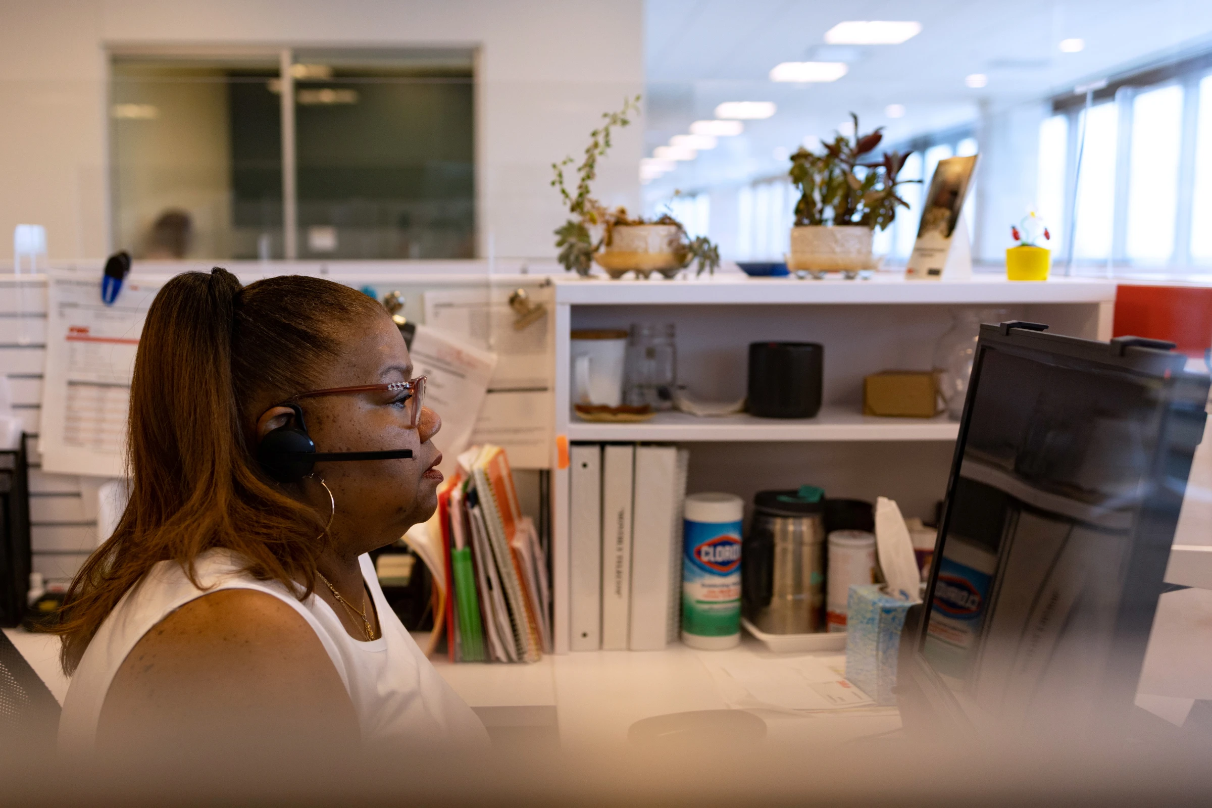 A woman works on her computer in Philadelphia, Pennsylvania, U.S., June 14, 2021. REUTERS/Hannah Beier