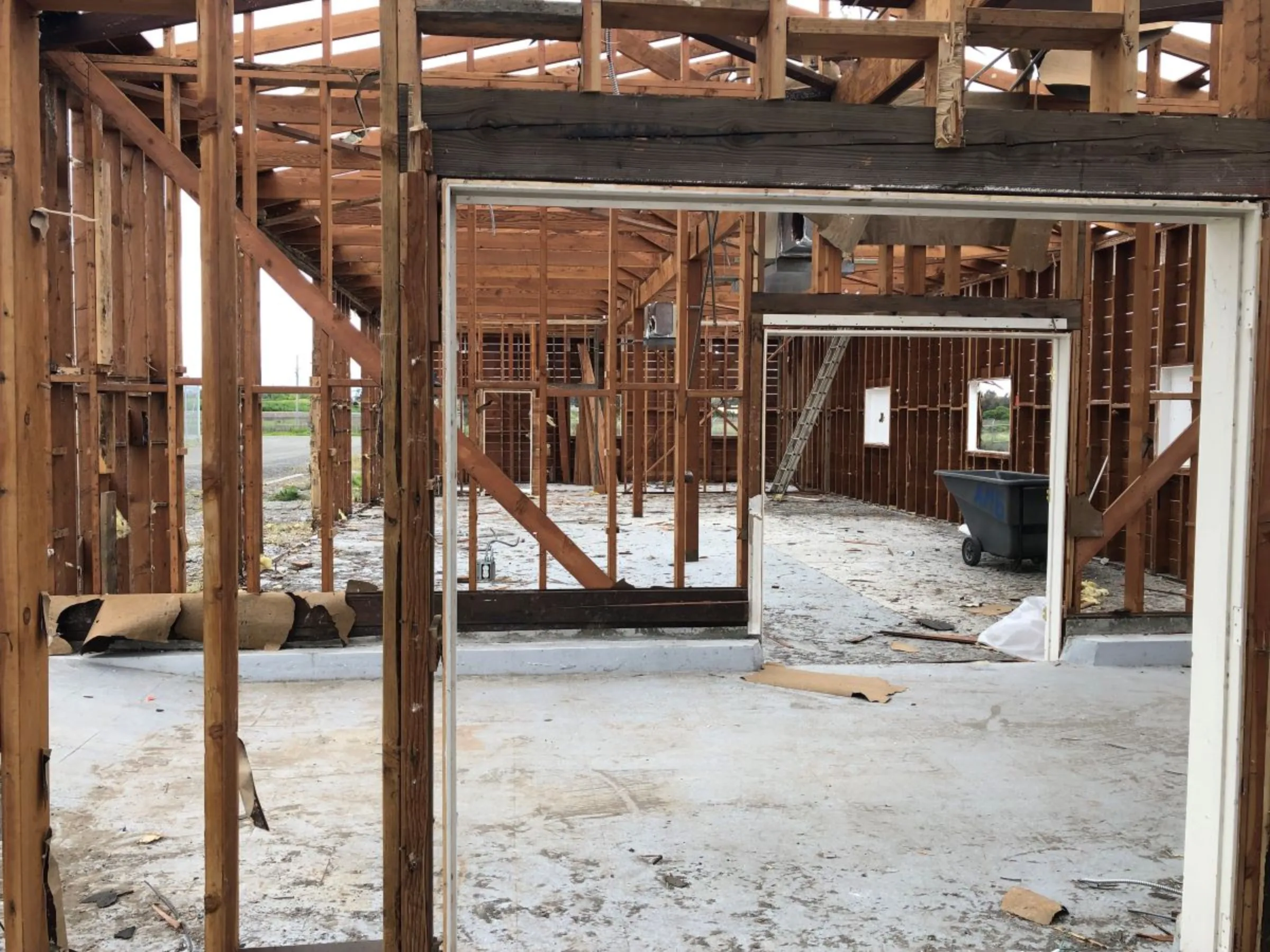 Workers take apart a commercial building as part of a deconstruction project in Palo Alto, California, in 2019. Zero Waste Palo Alto/Handout via Thomson Reuters Foundation