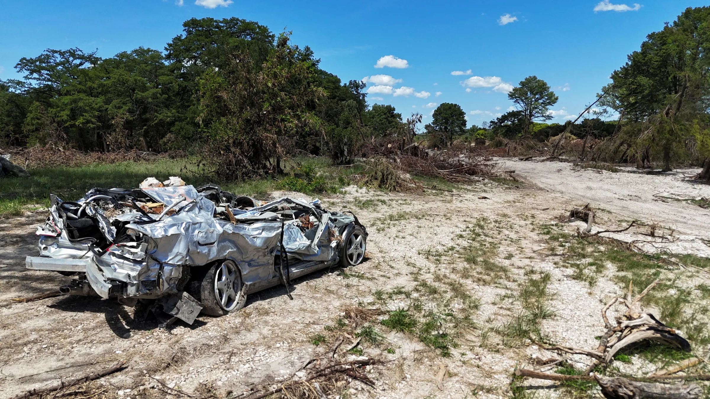 A drone view of a destroyed car near the Guadalupe River, in the aftermath of deadly flooding over the July Fourth weekend, in Ingram, Texas, U.S., July 31, 2025. REUTERS/Evan Garcia