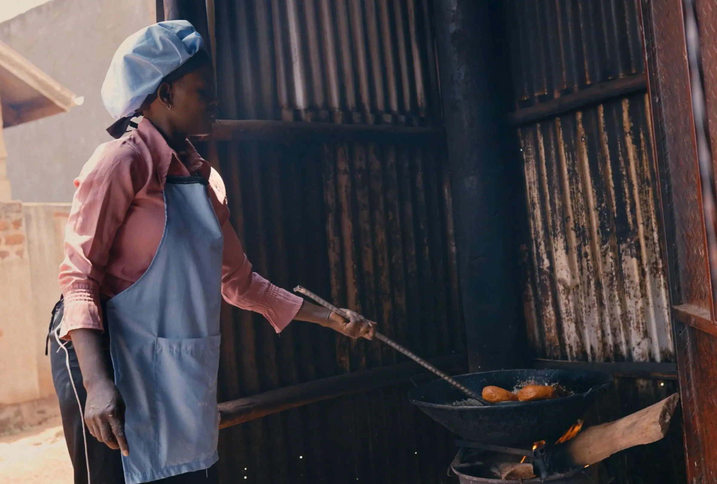 Emily poses for a picture at her bakery in Uganda. Emily is a survivor of human trafficking and was supported in her recovery and rehabilitation by the international charity, Everfree. Everfree/Handout via Thomson Reuters Foundation