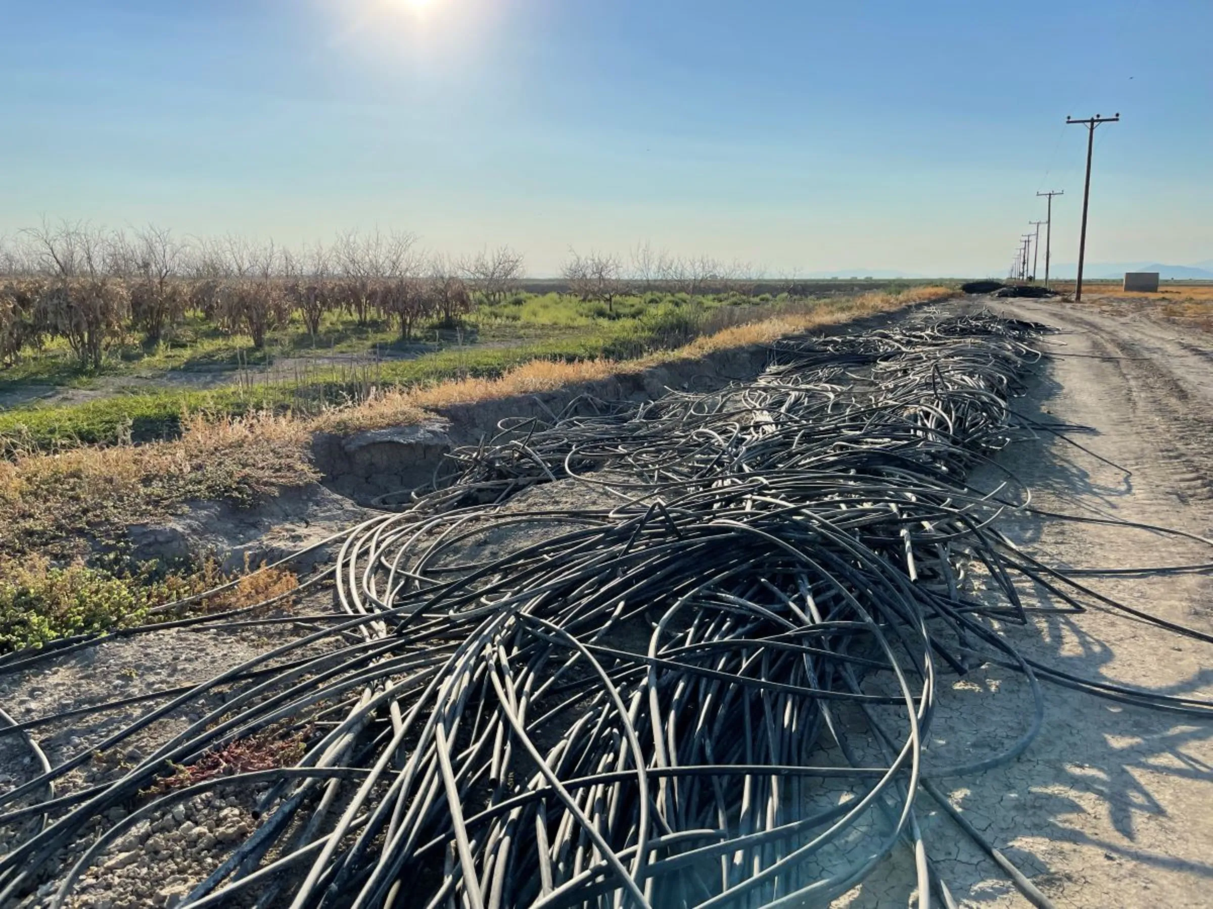 Image 24: Irrigation pipes that were washed away by flood water have been abandoned at the edge of fields in Sotirio, Larissa, Greece. July 29 2024. Thomson Reuters Foundation/Beatrice Tridimas