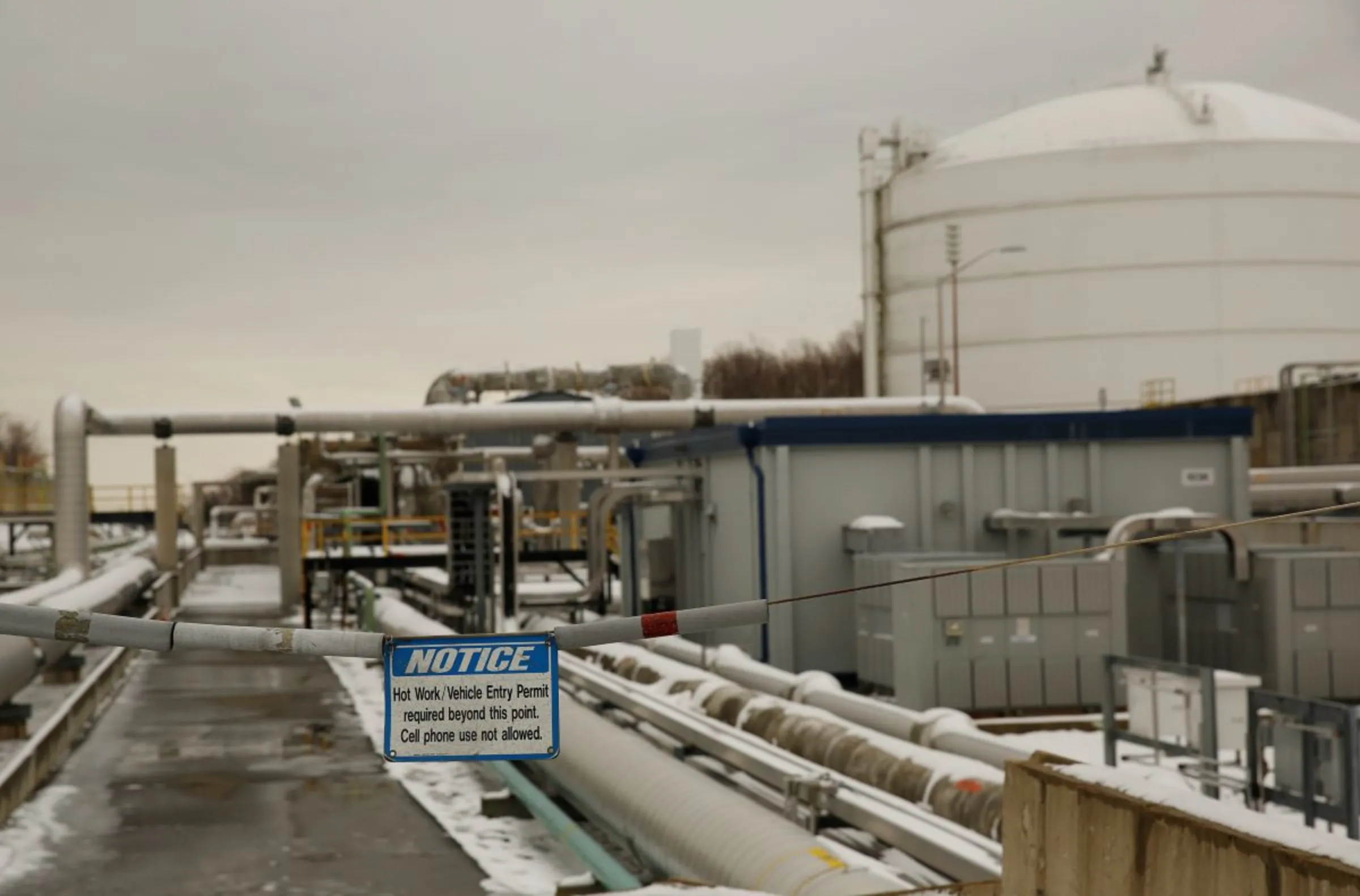A warning sign at the perimeter of a transfer line area is seen at the Dominion Cove Point Liquefied Natural Gas (LNG) terminal in Lusby, Maryland March 18, 2014