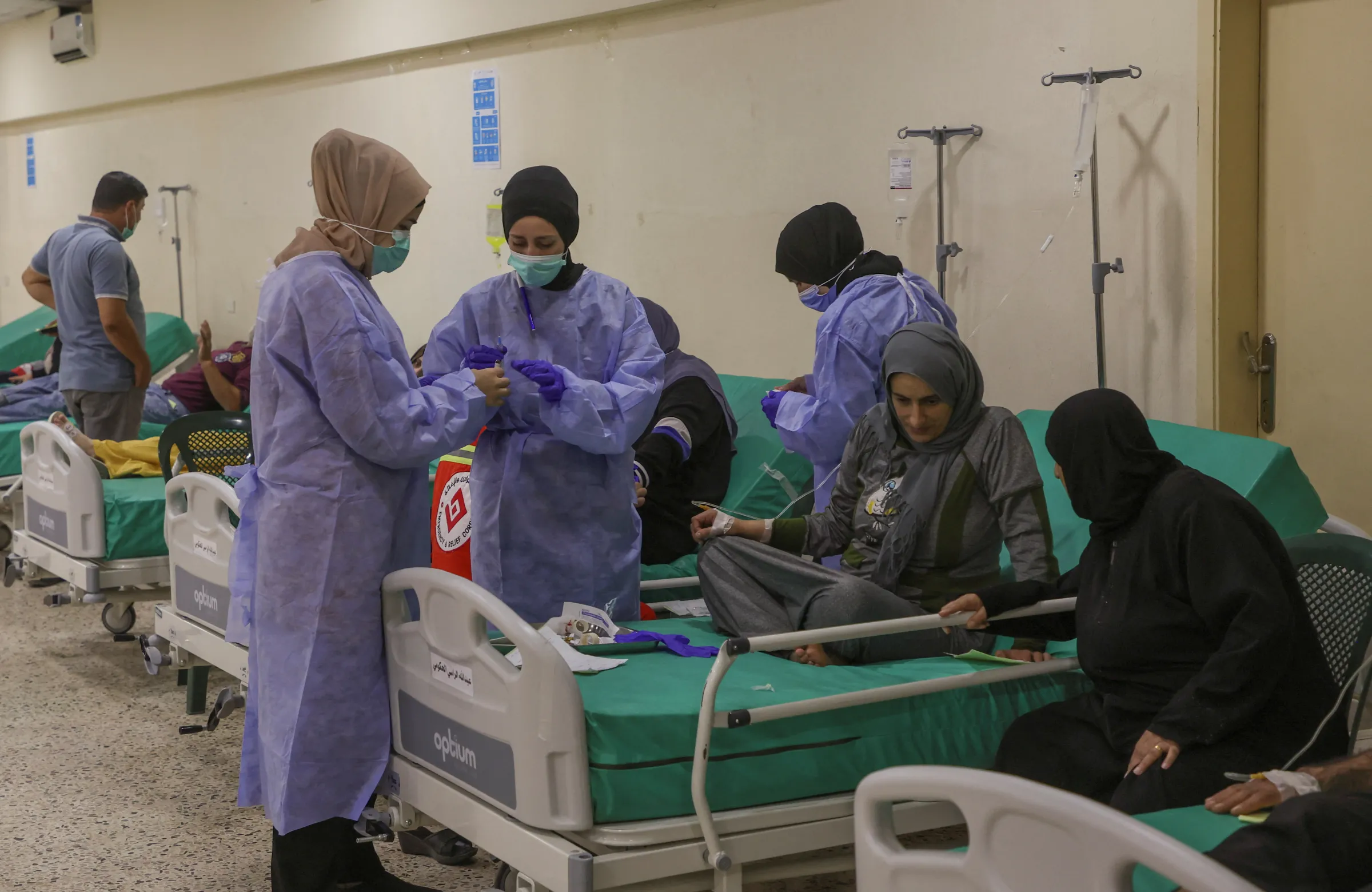 Health workers attend to suspected cholera patients inside a field hospital in Bebnine, Akkar district, northern Lebanon October 28, 2022