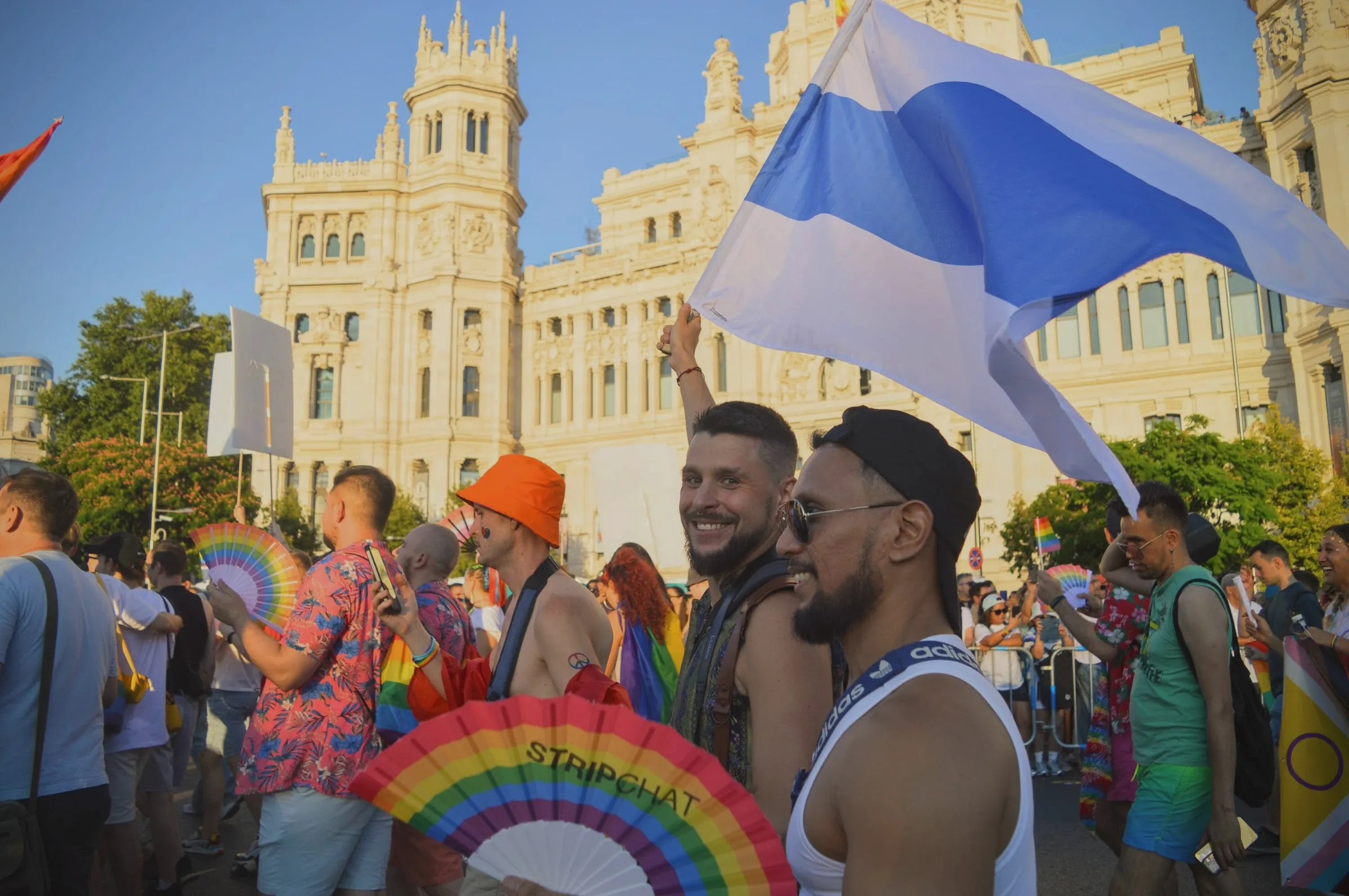Around 100 Russians march with rainbow flags and white-blue-white anti-war flags in front of the Palacio de Cibeles during at Madrid Pride, Madrid, Spain, July 6, 2024. Thomson Reuters Foundation/Laura Valentina Cortés Sierra