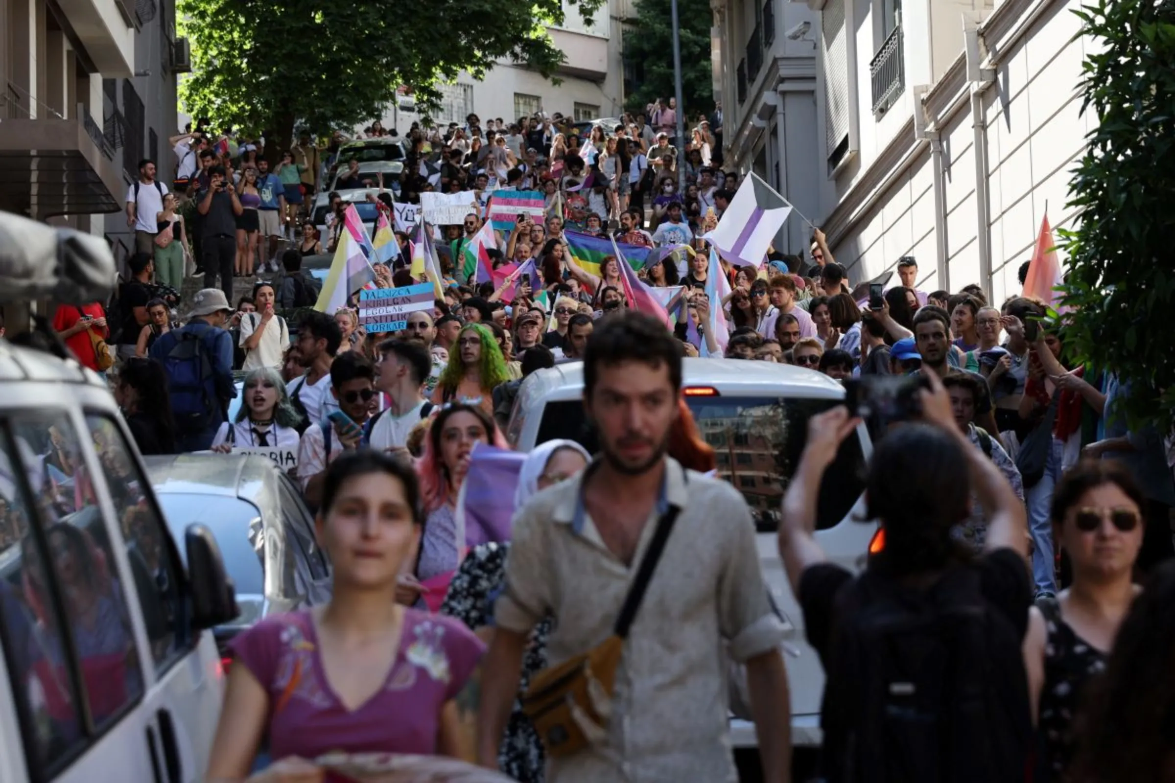 Demonstrators march as they try to gather for a pride parade, which was banned by local authorities, in central Istanbul, Turkey June 26, 2022. REUTERS/Umit Bektas