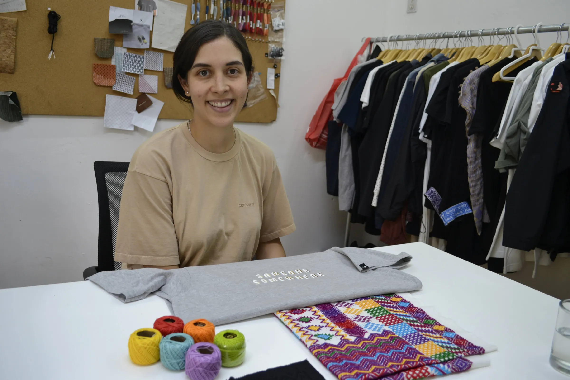 Fashion designer Regina Soto poses with clothes and fabrics produced for brand Someone Somewhere at its office in Mexico City, April 24, 2023. Thomson Reuters Foundation/Diana Baptista