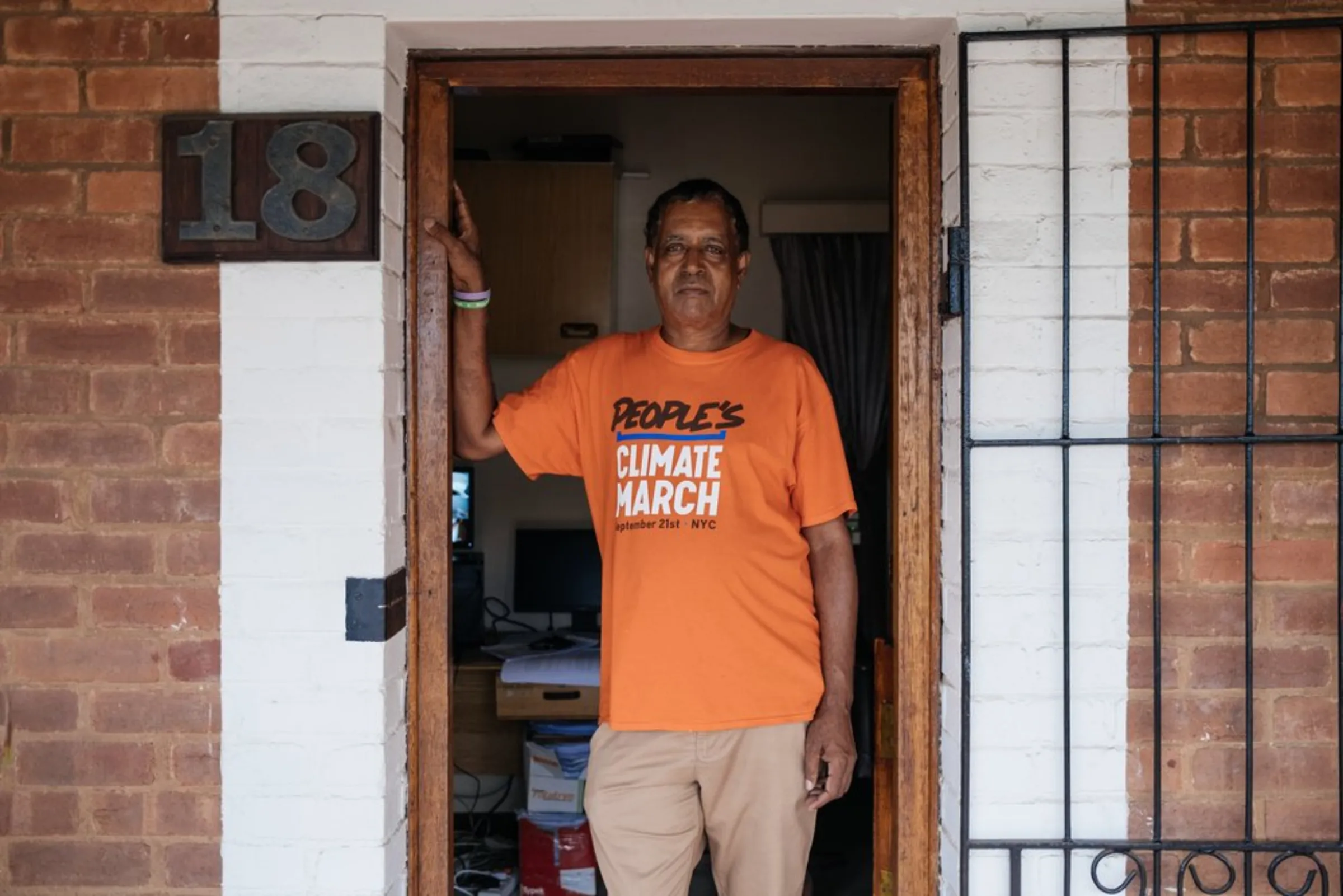 South Durban Community Environmental Alliance (SDCEA) co-ordinator Desmond D'Sa stands at the door of the SDCEA office in south Durban, South Africa, March 29, 2021. Winner of the Goldman Environmental Prize in 2014, his activism over the last 25 years has focused on trying to ensure a healthy living environment for poor communities living in heavily industrialised south Durban