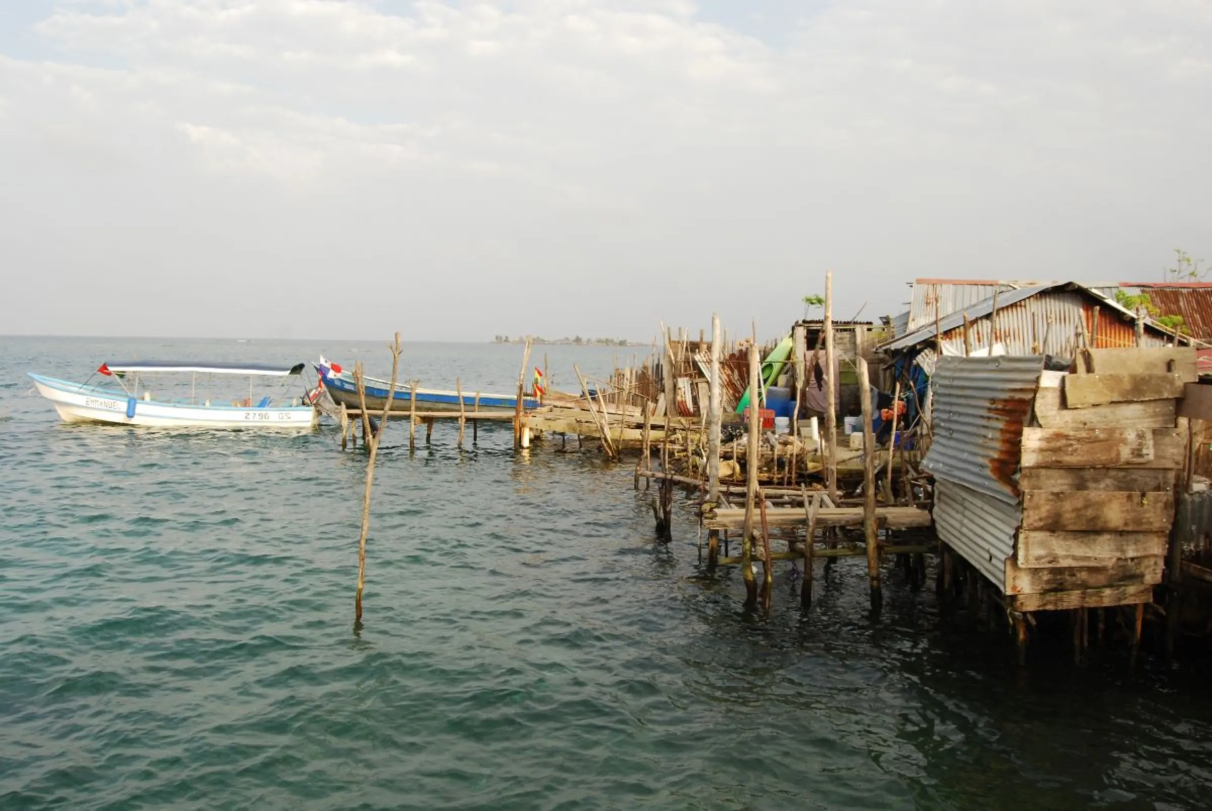 Gardi Sugdub island huts along the shoreline, Panama. February 17, 2024. Thomson Reuters Foundation / Anastasia Moloney