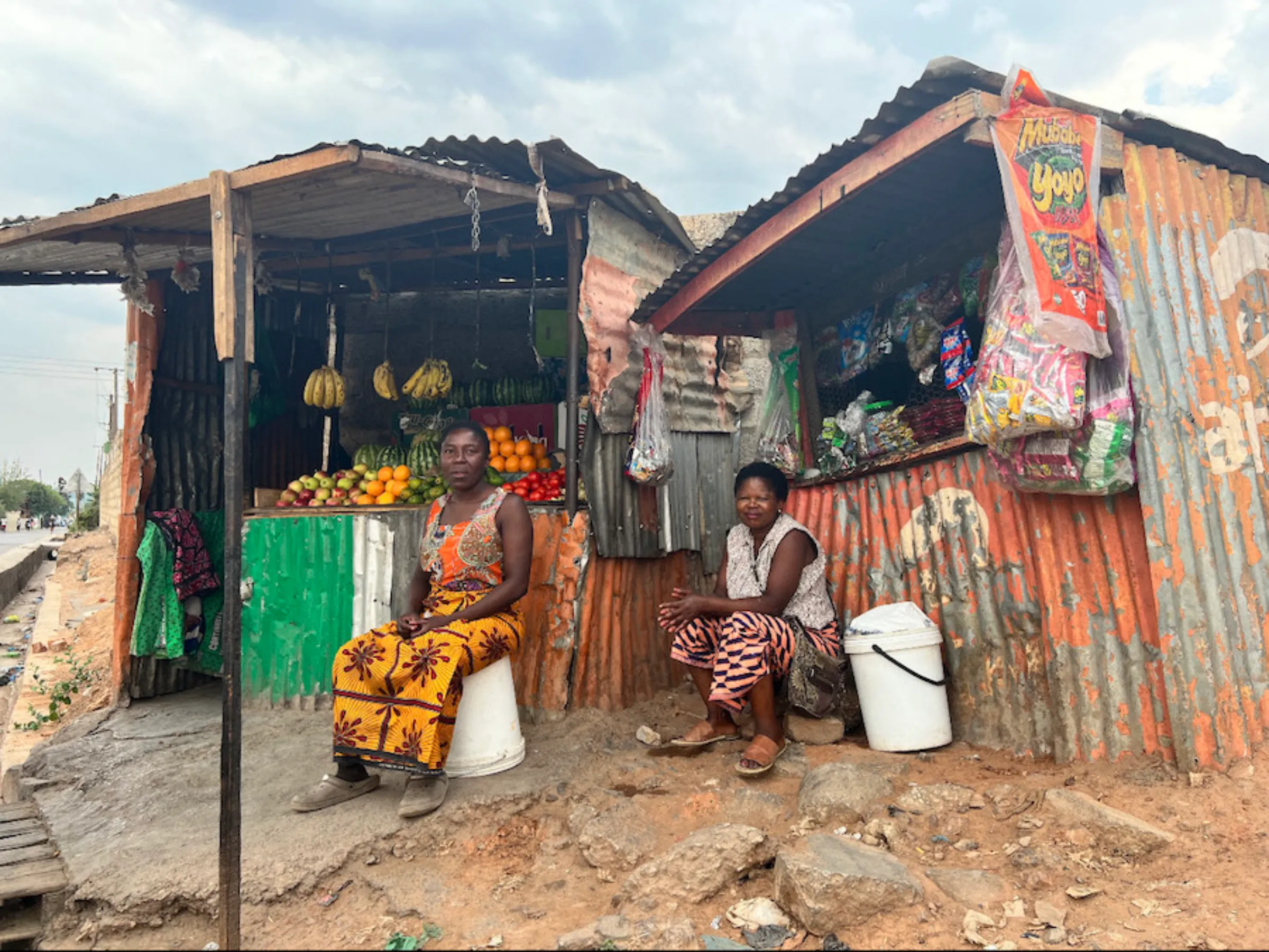 Yvonne Mwansa (R) and her daughter Mirriam Mwansa pose for a picture at their kiosk in Ng'ombe, Lusaka. October 21, 2022