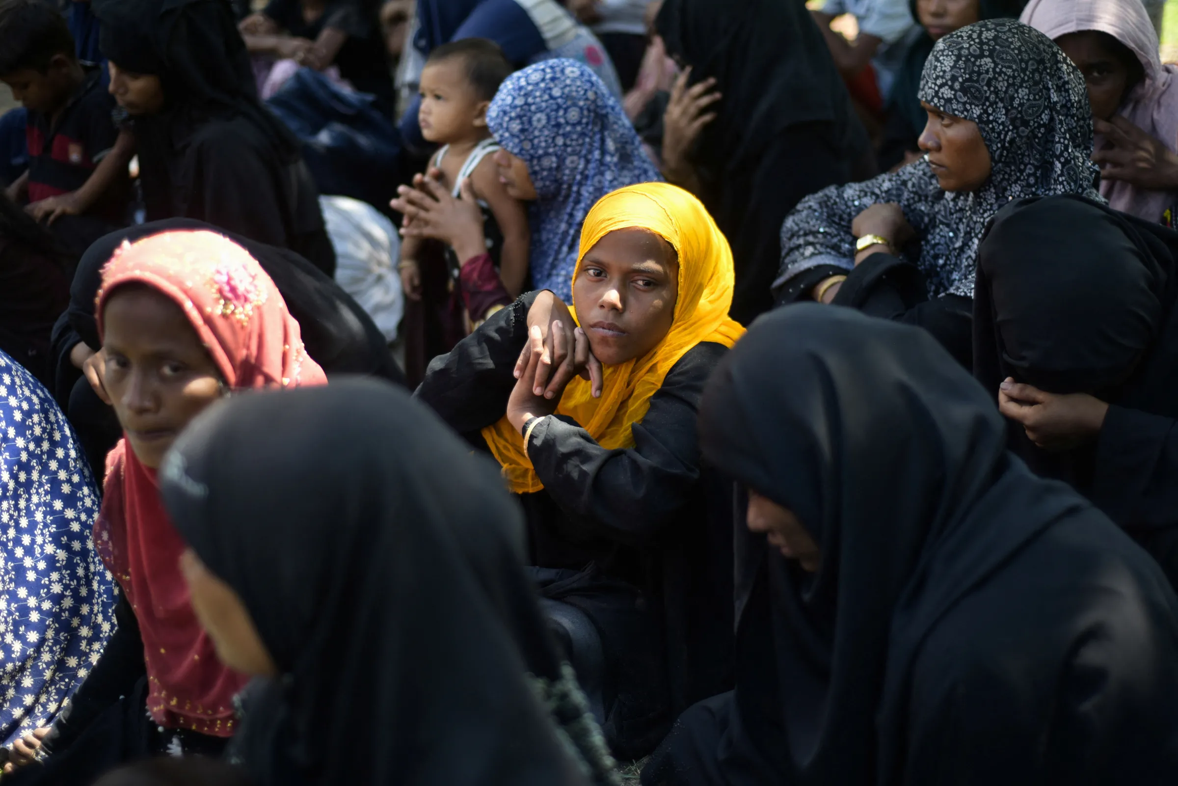 Rohingya Muslim women rest after landing in Blang Ulam, Aceh province, Indonesia, December 10, 2023. REUTERS/Riska Munawarah