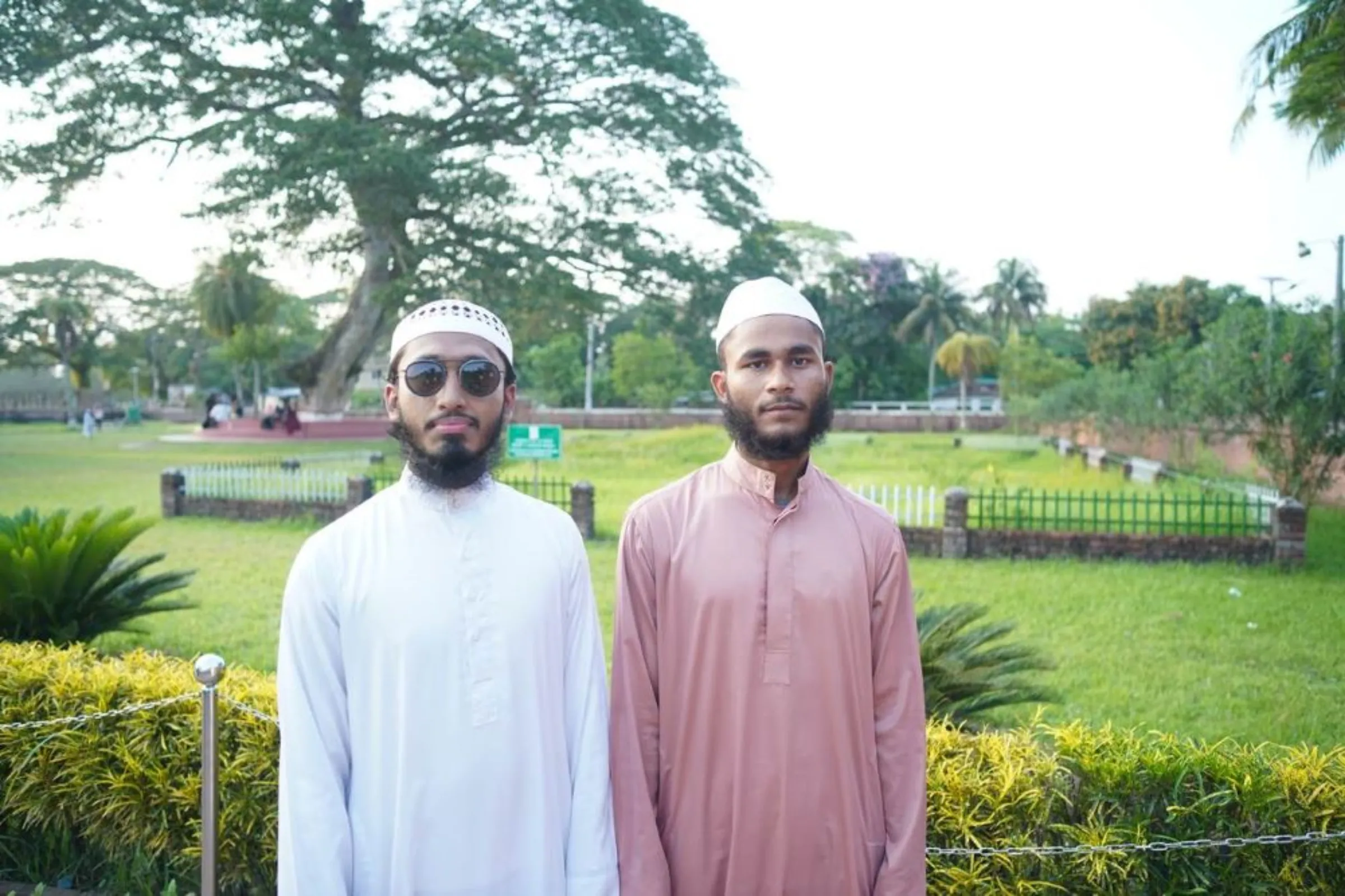 Friends Asad Hossain and Monir Hossain visit the Sixty Dome Mosque Site in Bagherhat, in southern Bangladesh, May 4, 2022