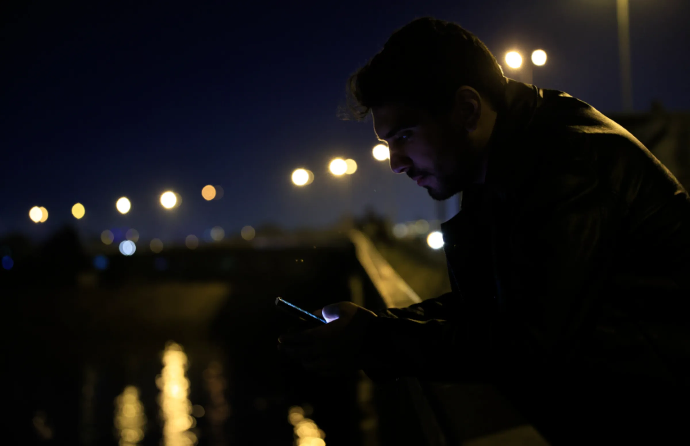 Ali al-Mikdam looks at his phone in Baghdad, Iraq, January 31, 2023
