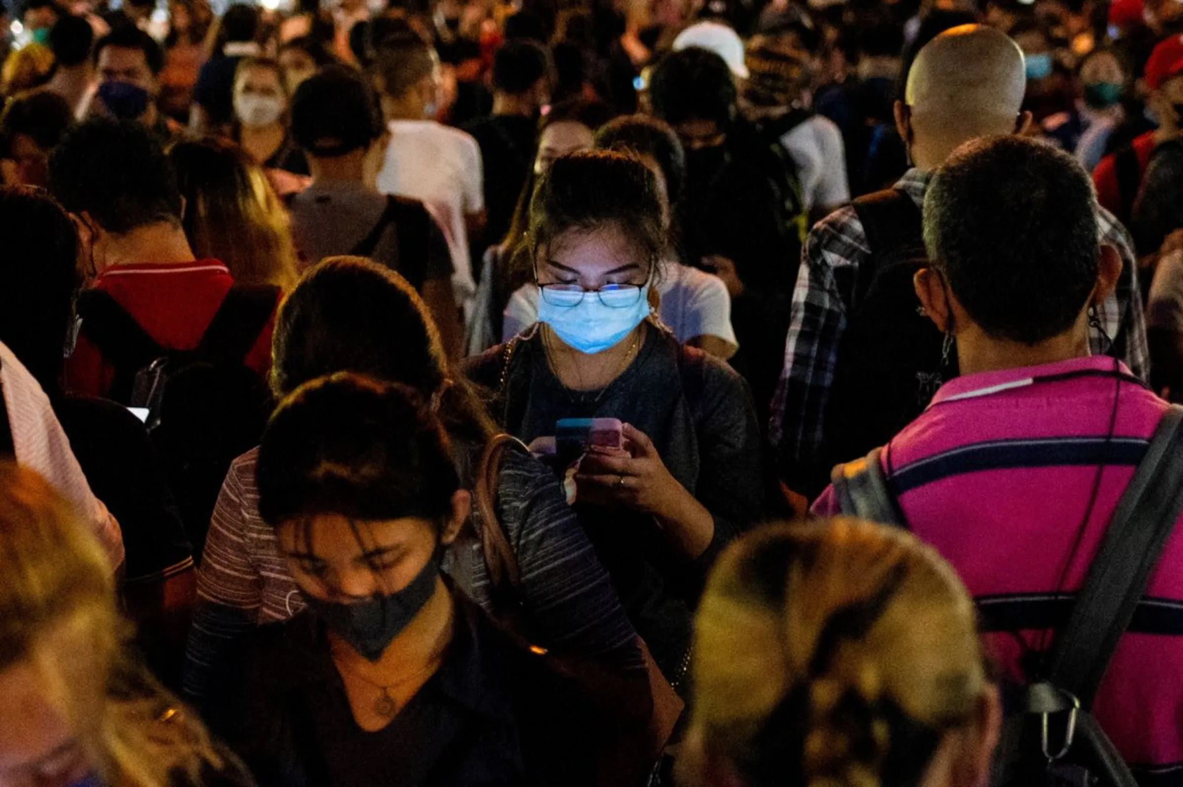 Commuters queue at a bus station in Mandaluyong, Philippines, July 15, 2022. REUTERS/Lisa Marie David