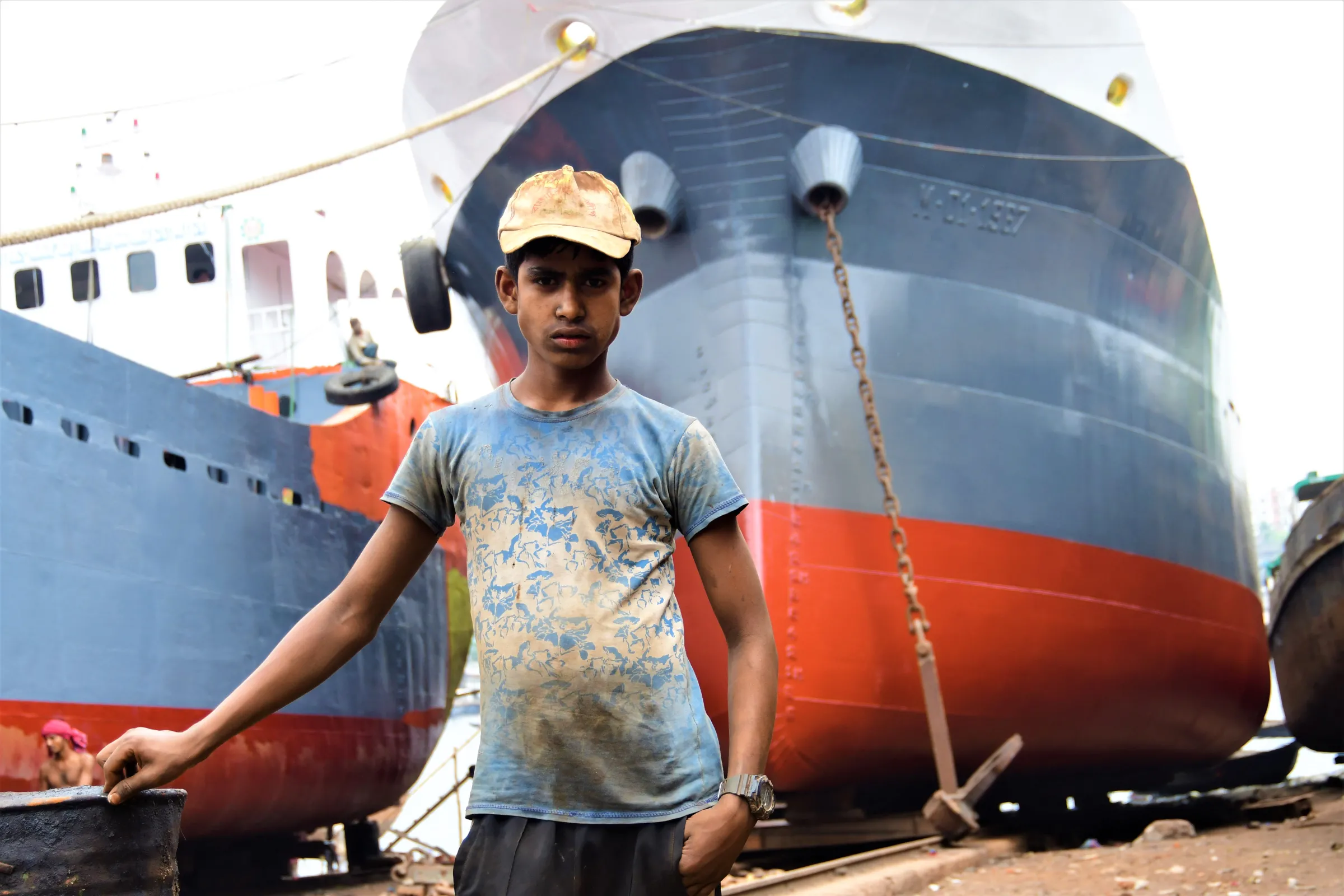 Alamin, 12, whose family lost their home to climate change-driven erosion, works as part of a shipbreaking crew in Keraniganj, close to Dhaka, Bangladesh, March 22, 2022. Thomson Reuters Foundation/Mosabber Hossain