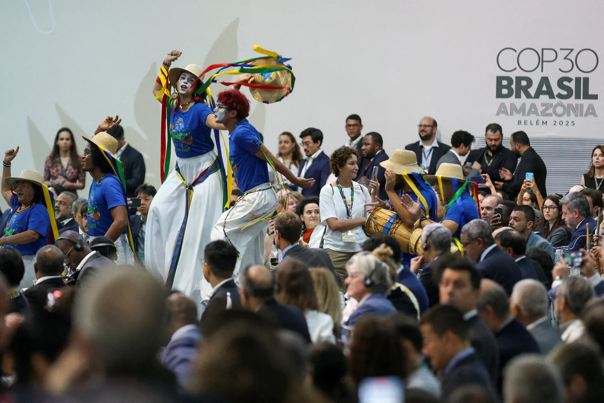 Artists from Arraial do Pavulagem group perform during the opening of the Belem Climate Summit plenary session, as part of the United Nations Climate Change Conference (COP30), in Belem, Brazil, November 6, 2025. REUTERS/Anderson Coelho