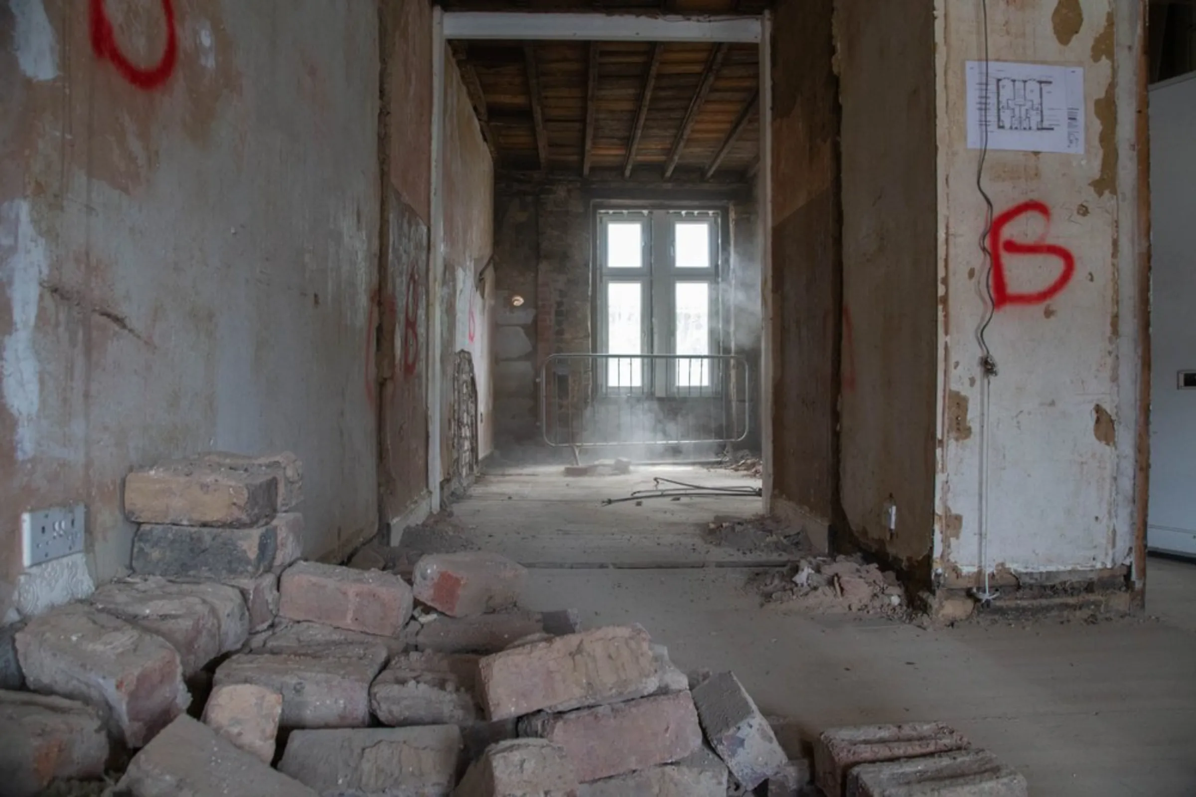 The hallway of a tenement flat is pictured midway through a retrofit project in Glasgow, United Kingdom, July 23, 2021. Finding the balance between heritage and energy efficiency is difficult when refitting old tenements, said Drew Carr of John Gilbert Architects, which is leading the project