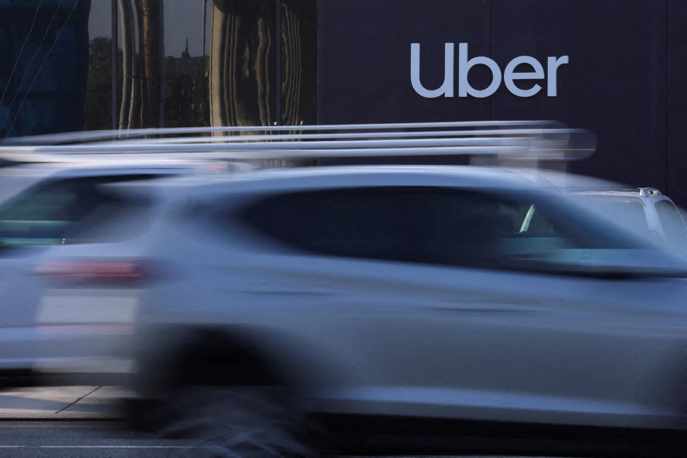 An Uber office is shown behind moving traffic in Redondo Beach, California