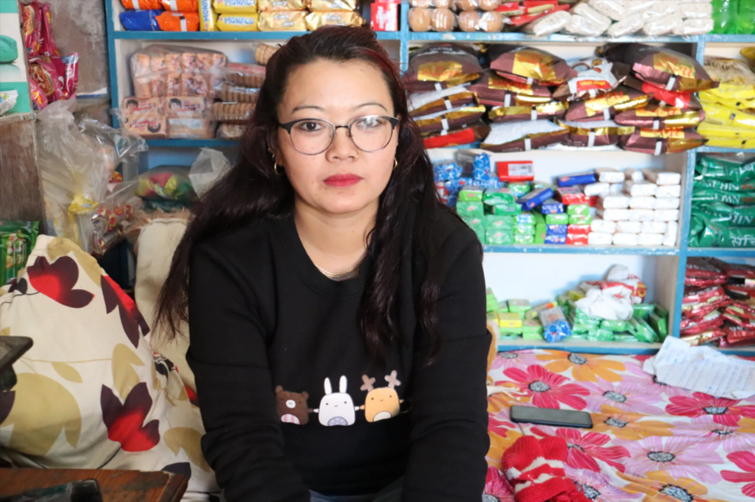 Lalita Rai, wife of Anup Rai, poses in her room in Kathmandu. December 16, 2022