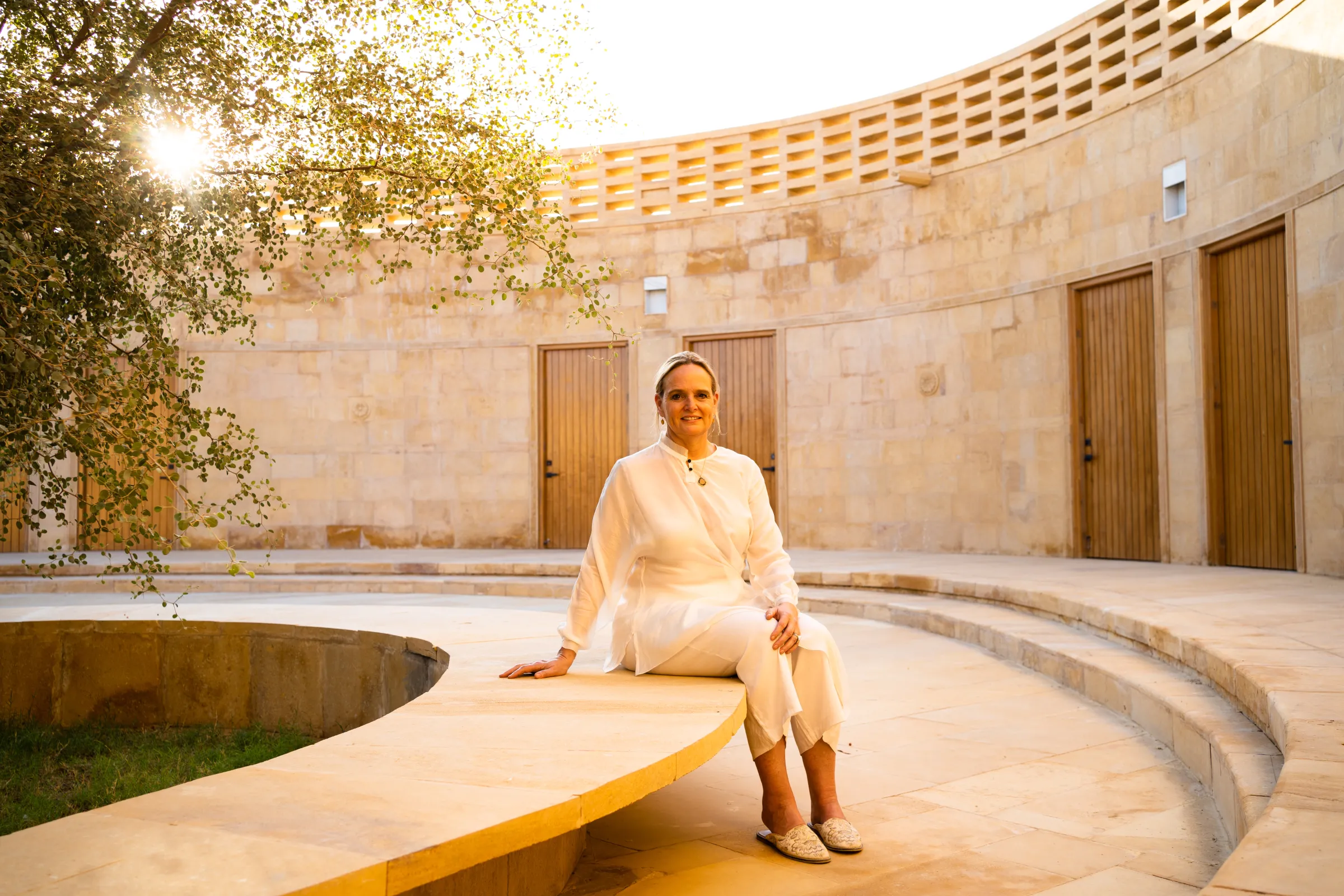Architect Diana Kellogg sits in the courtyard of the Rajkumari Ratnavati Girls School. Diana Kellogg Architects/Handout via Thomson Reuters Foundation