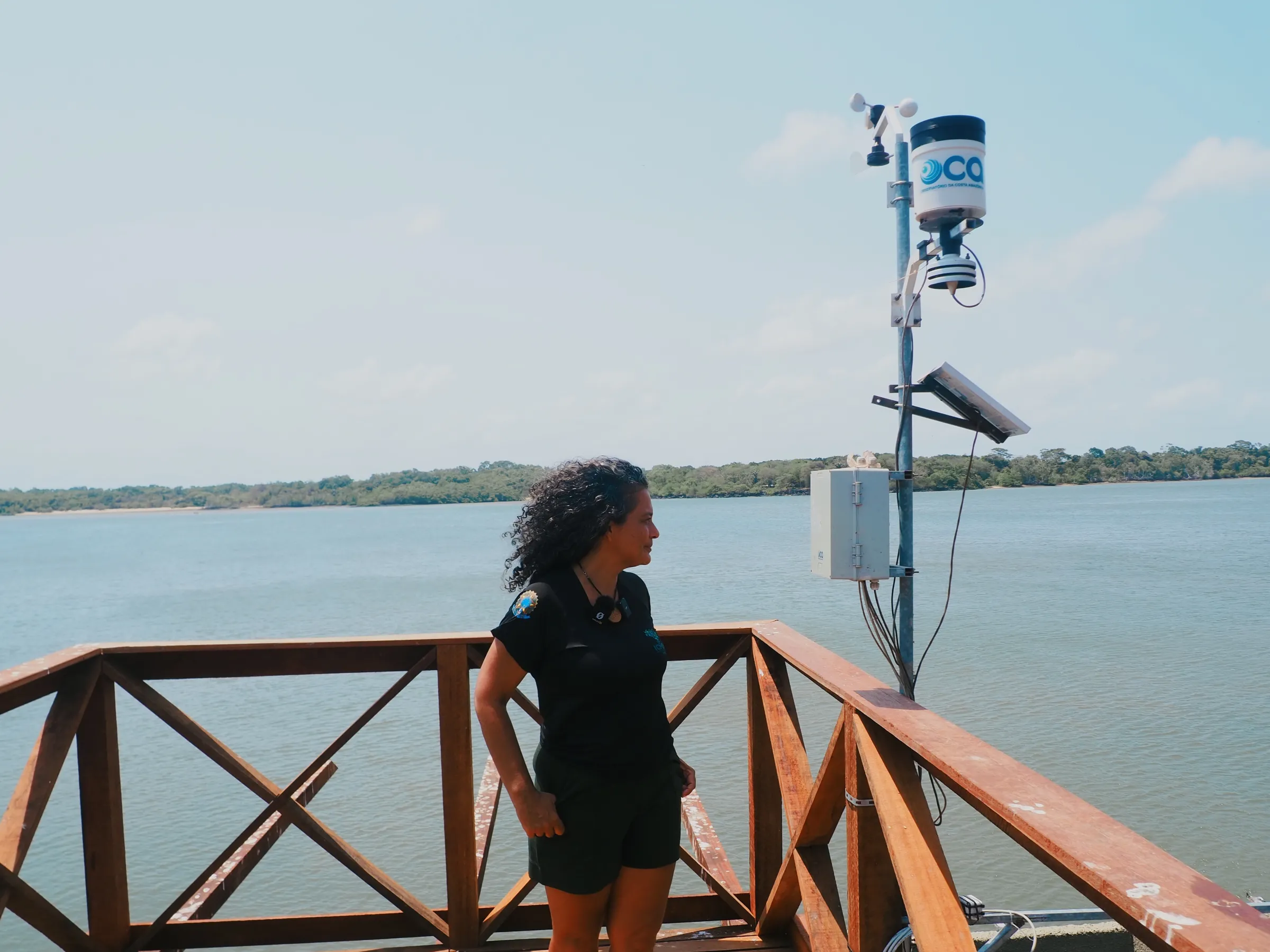Lisângela Cassiano of ICMBio stands beside a low-cost monitoring sensor used in the reserve, Marajó Island, Pará, Brazil, 16 November 2025. Thomson Reuters Foundation/Rosalind Thacker