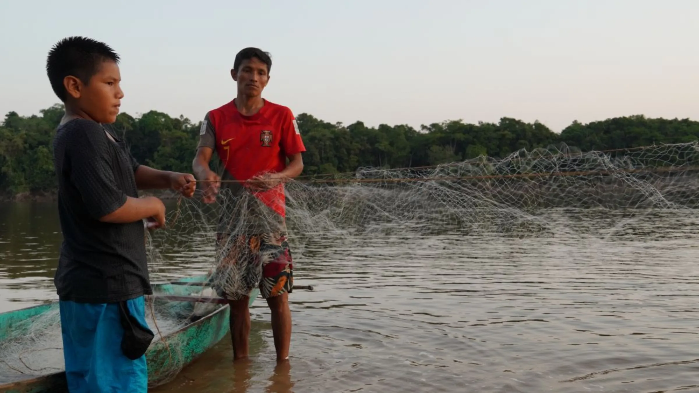 Fishung at dusk on the Nanay River, Loreto, Peru, August 18, 2024. Thomson Reuters Foundation/Dan Collyns